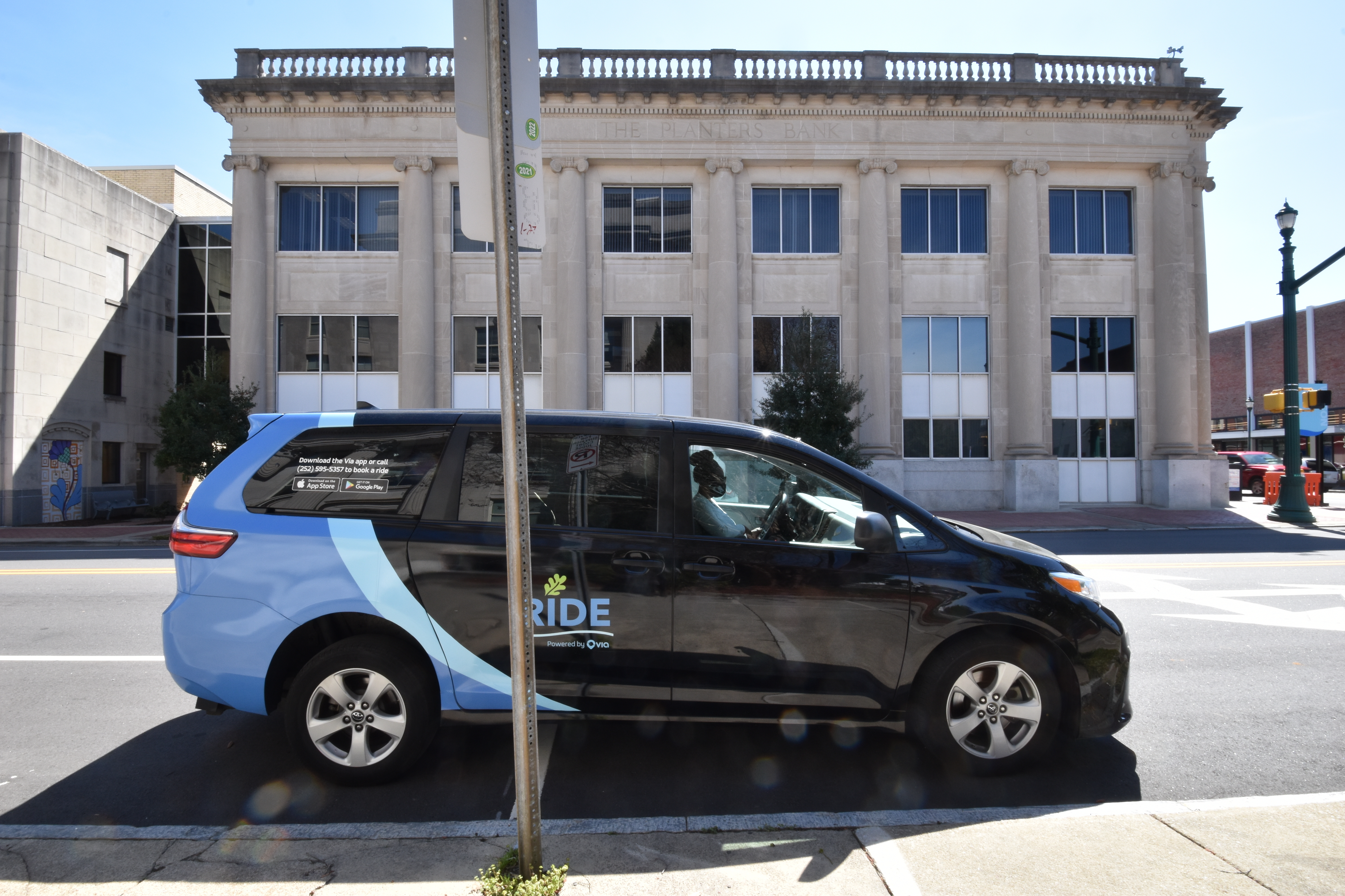 A RIDE minivan parks across the street from City Hall in Wilson, N.C. (Nick Delacanal/ WFAE)