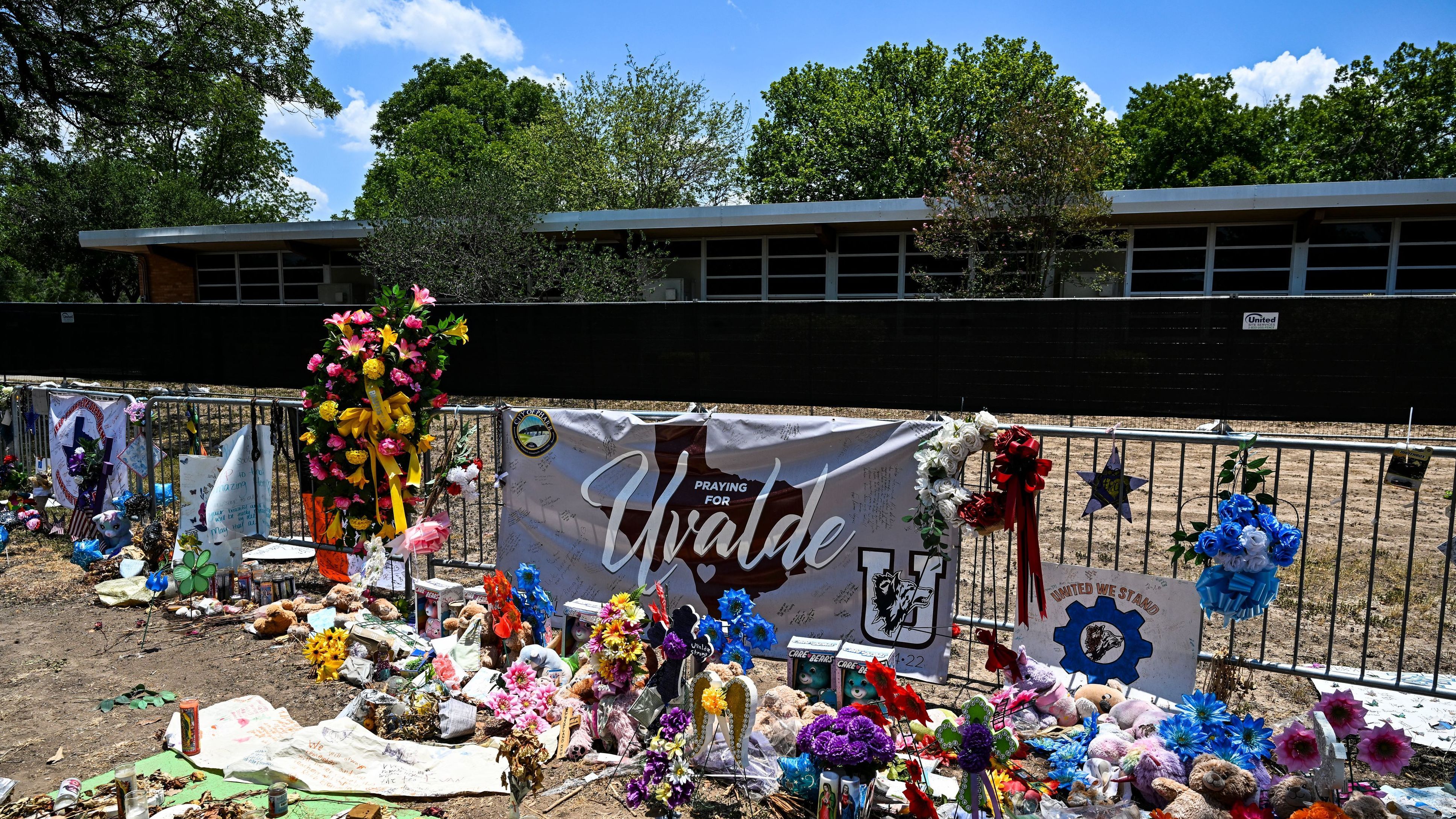Mementos decorate a makeshift memorial to shooting victims outside of Robb Elementary School in Uvalde, Texas.