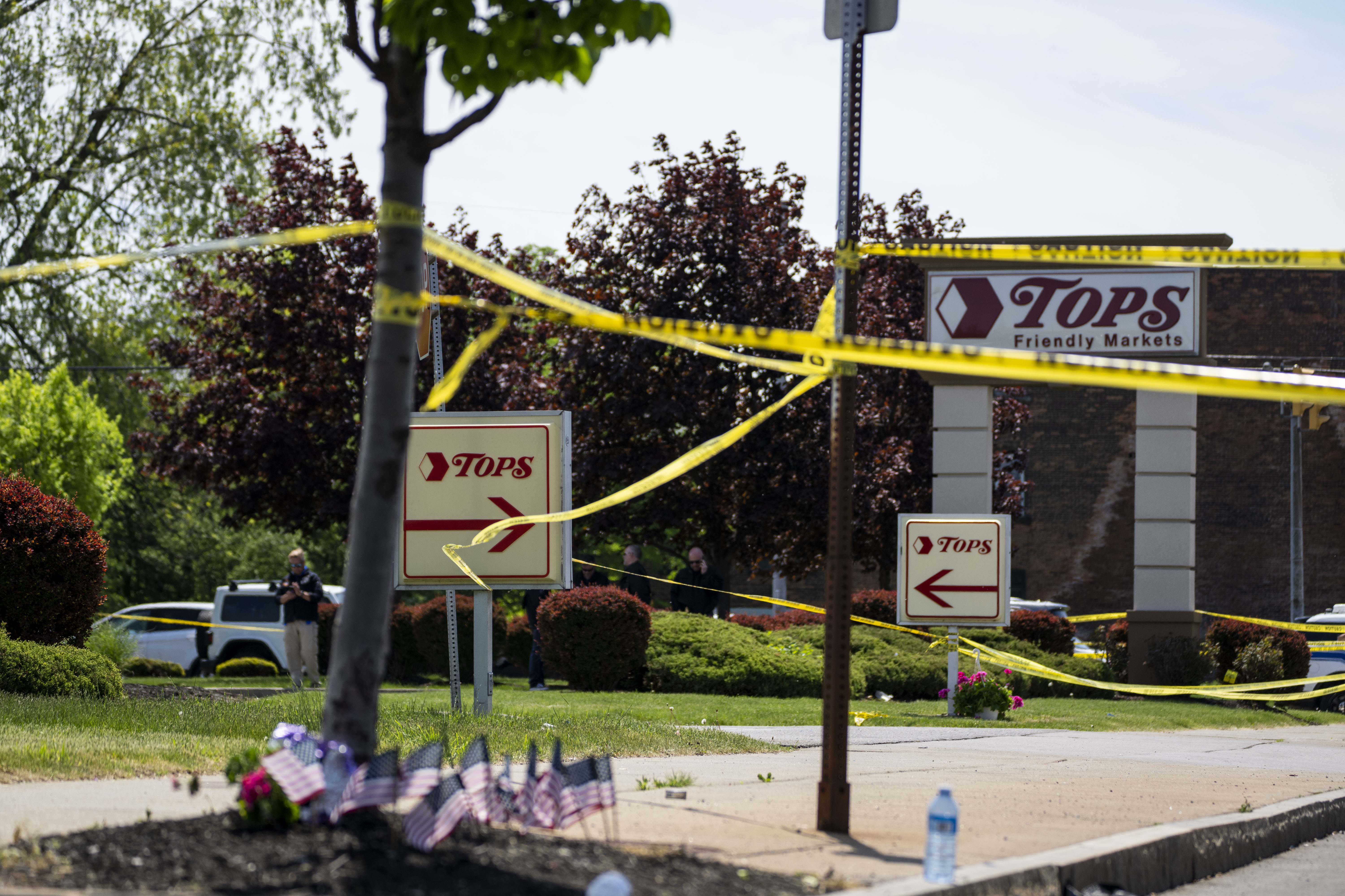 Police tape surrounds Tops Friendly Market the day after the fatal shooting of 10 people on May 14 in Buffalo, N.Y. (Los Angeles Times via Getty Image)