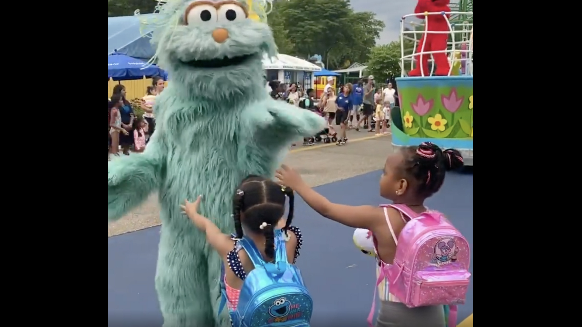 Sesame Place apologizes after video shows 2 Black girls being passed over at a parade