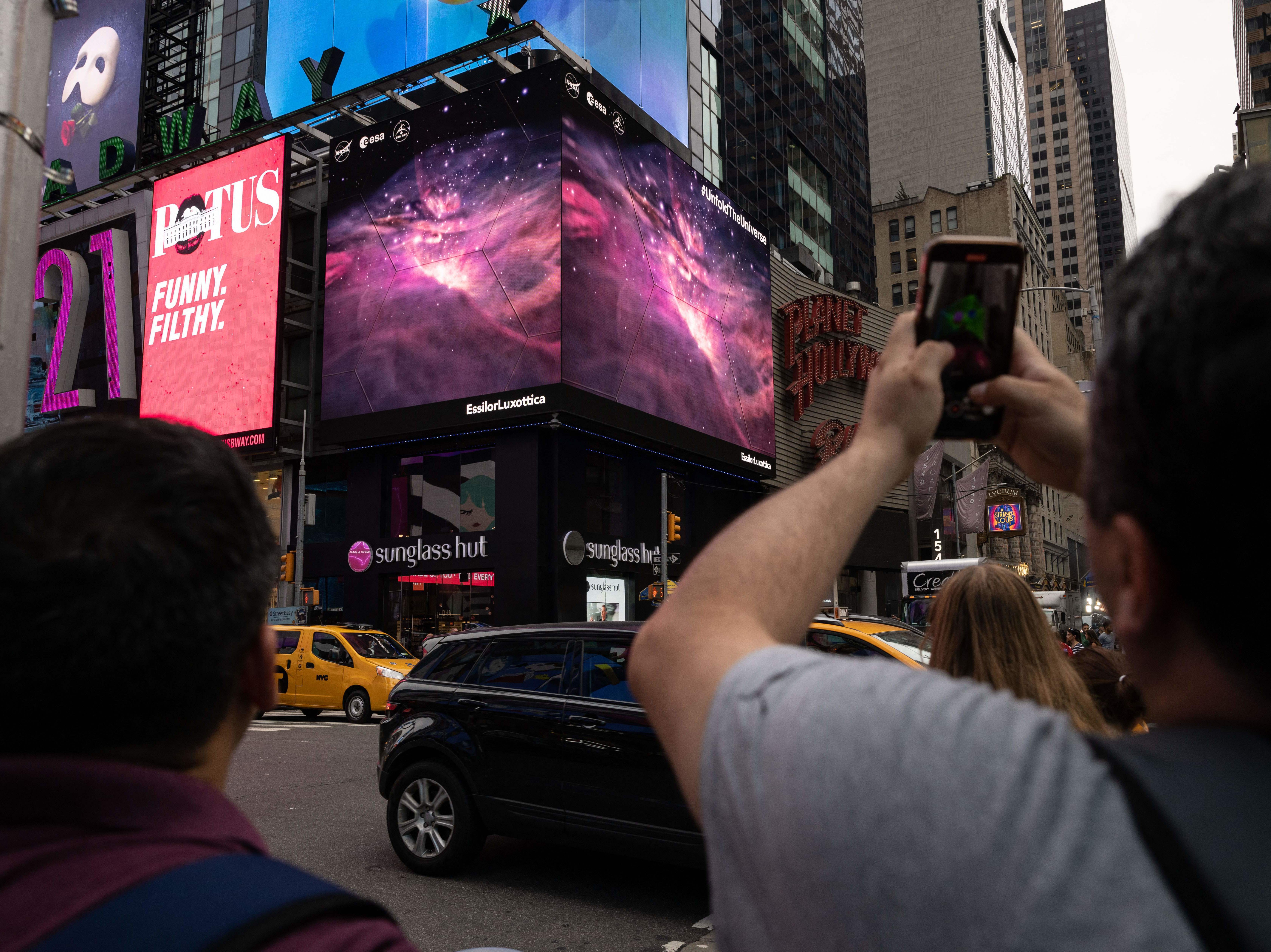 As the first James Webb Space Telescope images appeared in New York's Times Square and everywhere else, scientists got to work diving deep into the data. (AFP via Getty Images)