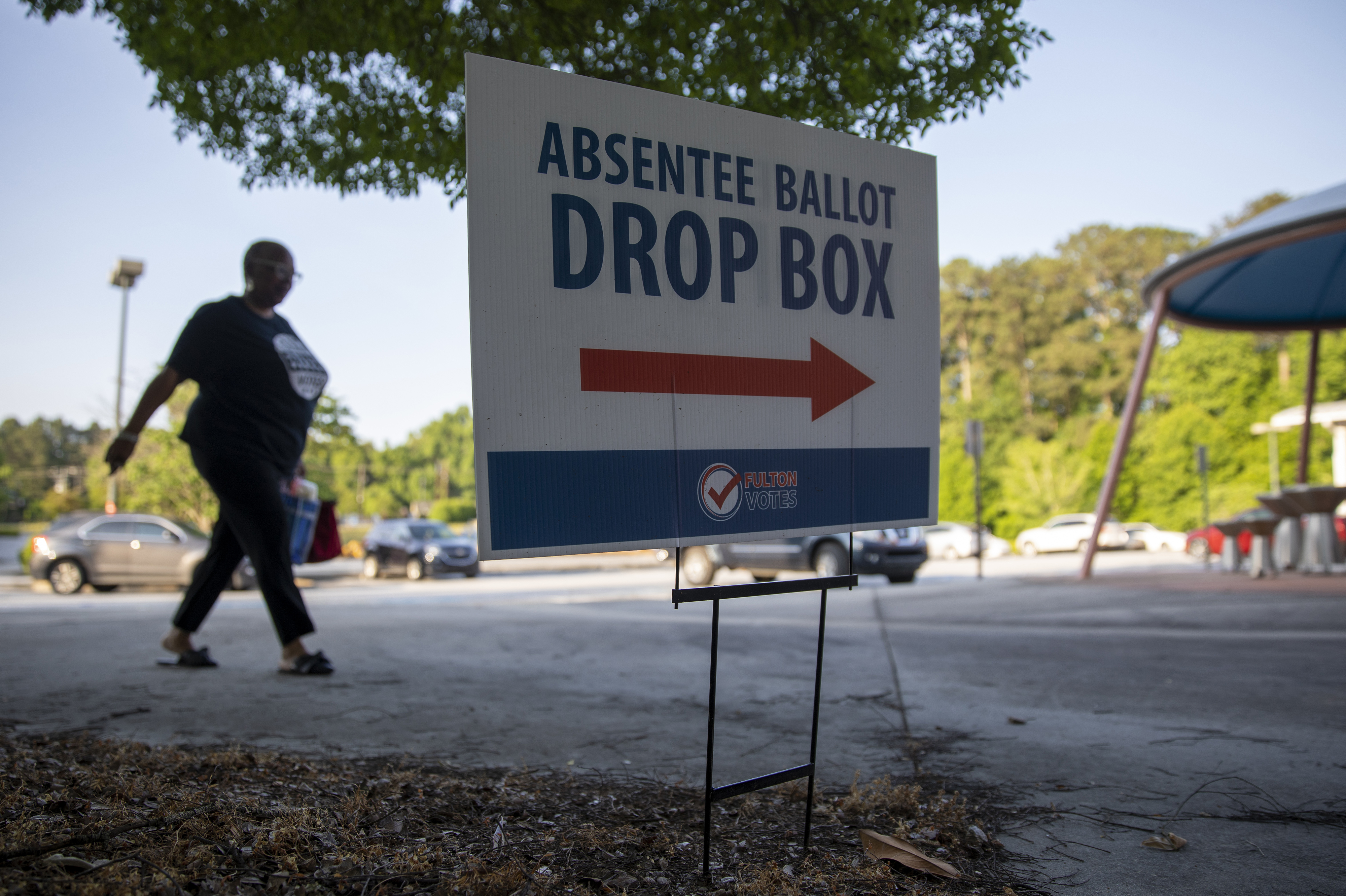 A sign indicates that an absentee ballot drop box is available to voters outside a Fulton County early voting site at C.T. Martin Natatorium and Recreation Center in Atlanta on May 18. (Alyssa Pointer for NPR)
