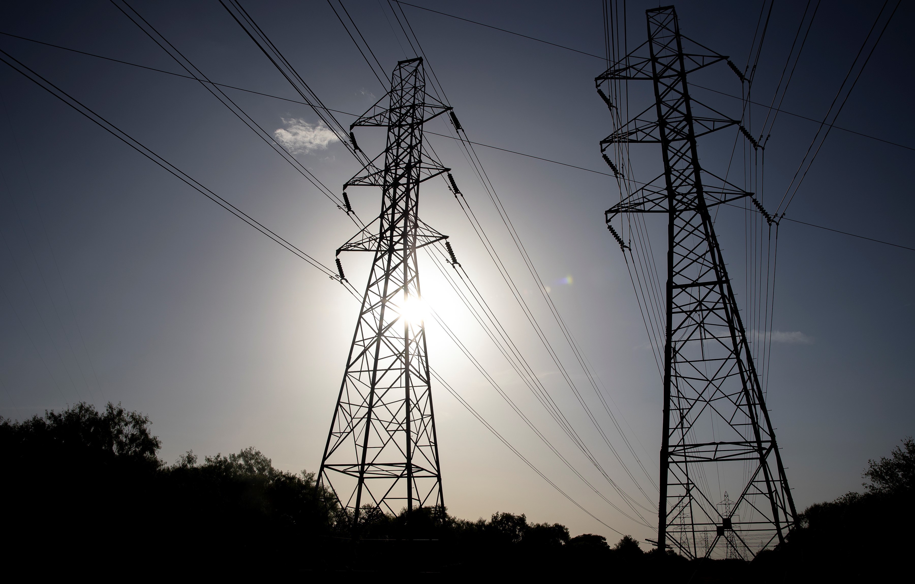 Power transmission lines span toward San Antonio, Texas. More than 100 million people are currently under heat-related warnings and advisories across the United States, the National Weather Service Weather Prediction Center said Tuesday. (Xinhua News Agency via Getty Images)