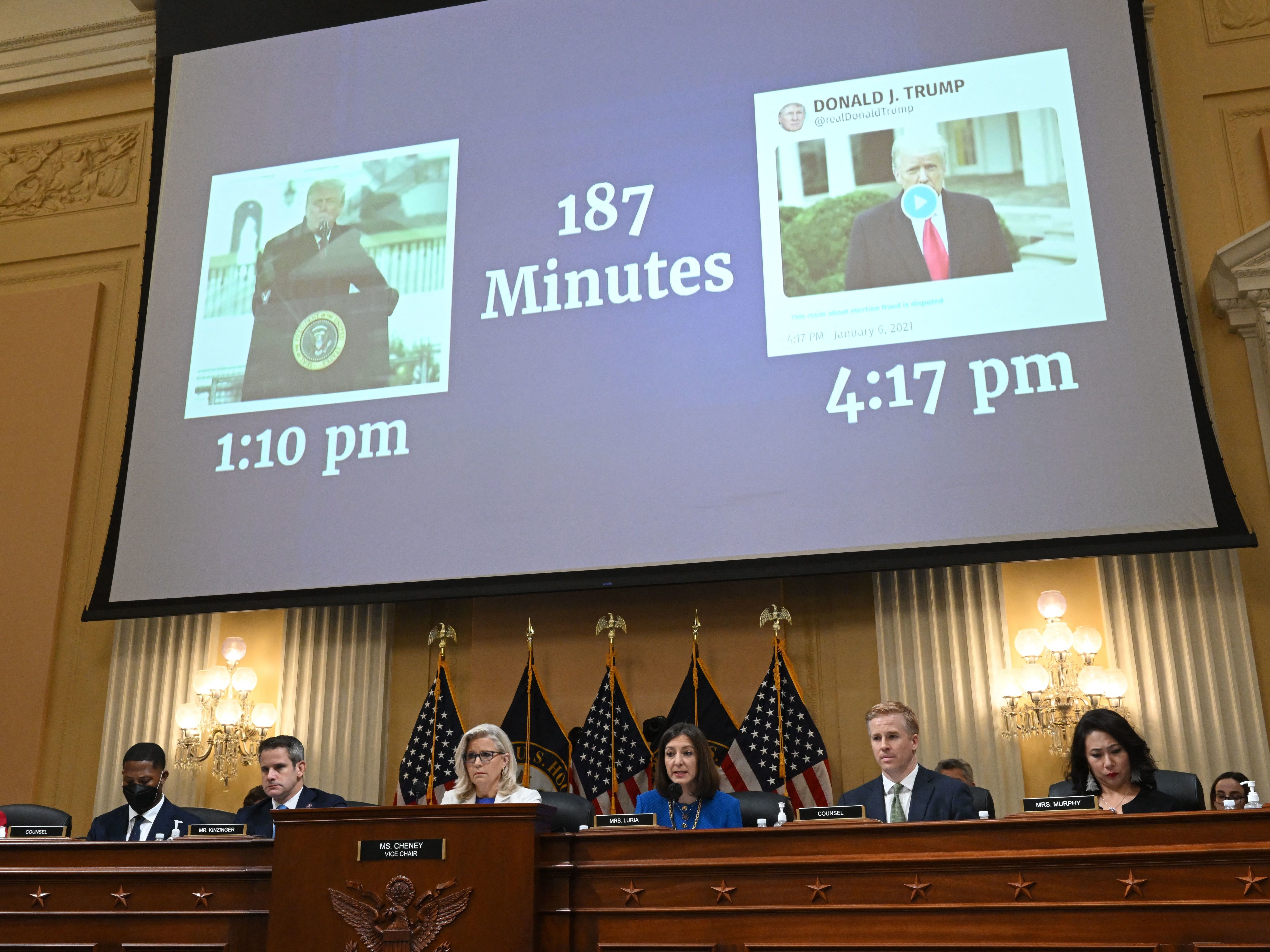 &quot;187 Minutes&quot; is displayed on a screen between images of former President Trump during a hearing by the House Select Committee on July 21, 2022. (AFP via Getty Images)