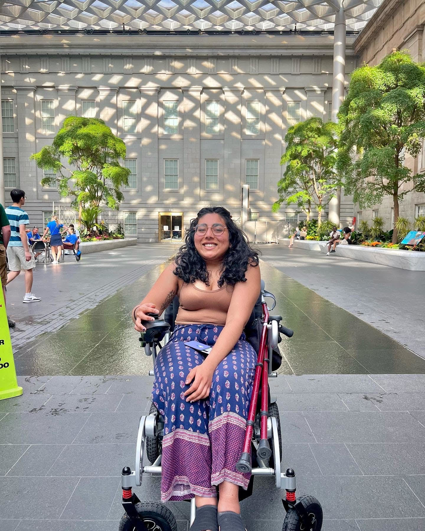 Shruti Rajkumar sitting in a wheelchair at a museum in Washington, D.C. (Justin Ramirez)