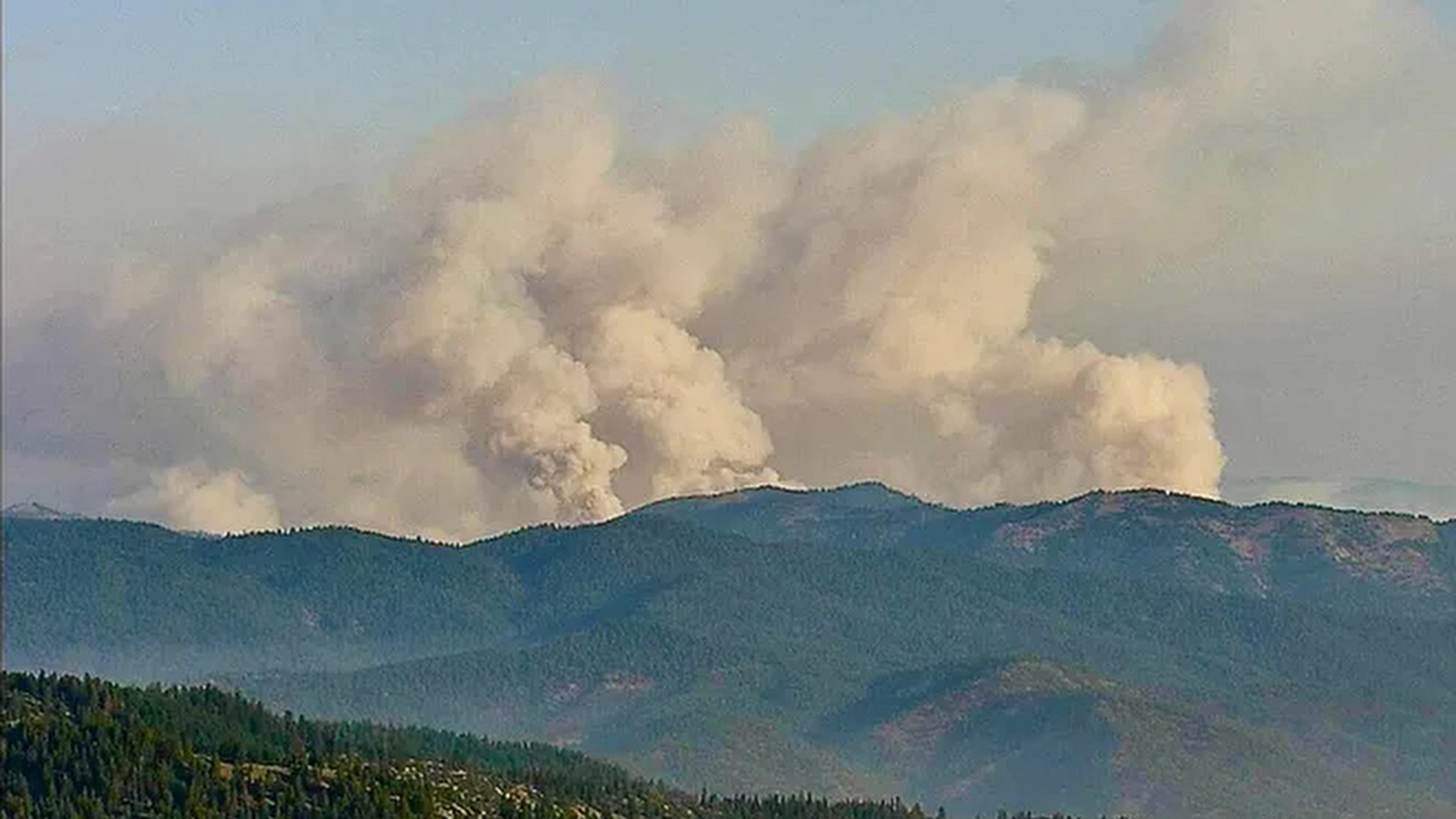 Windy, hot conditions fuel the explosive growth of fires in California and Montana