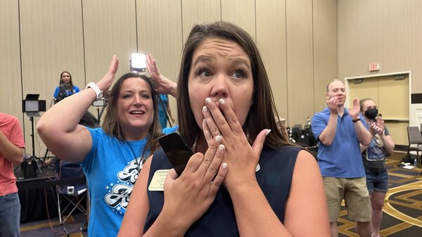 Kansas state Rep. Stephanie Clayton, an abortion rights supporter who was a Republican and is now a Democrat, reacts as a referendum to strip abortion rights out of the state constitution fails.