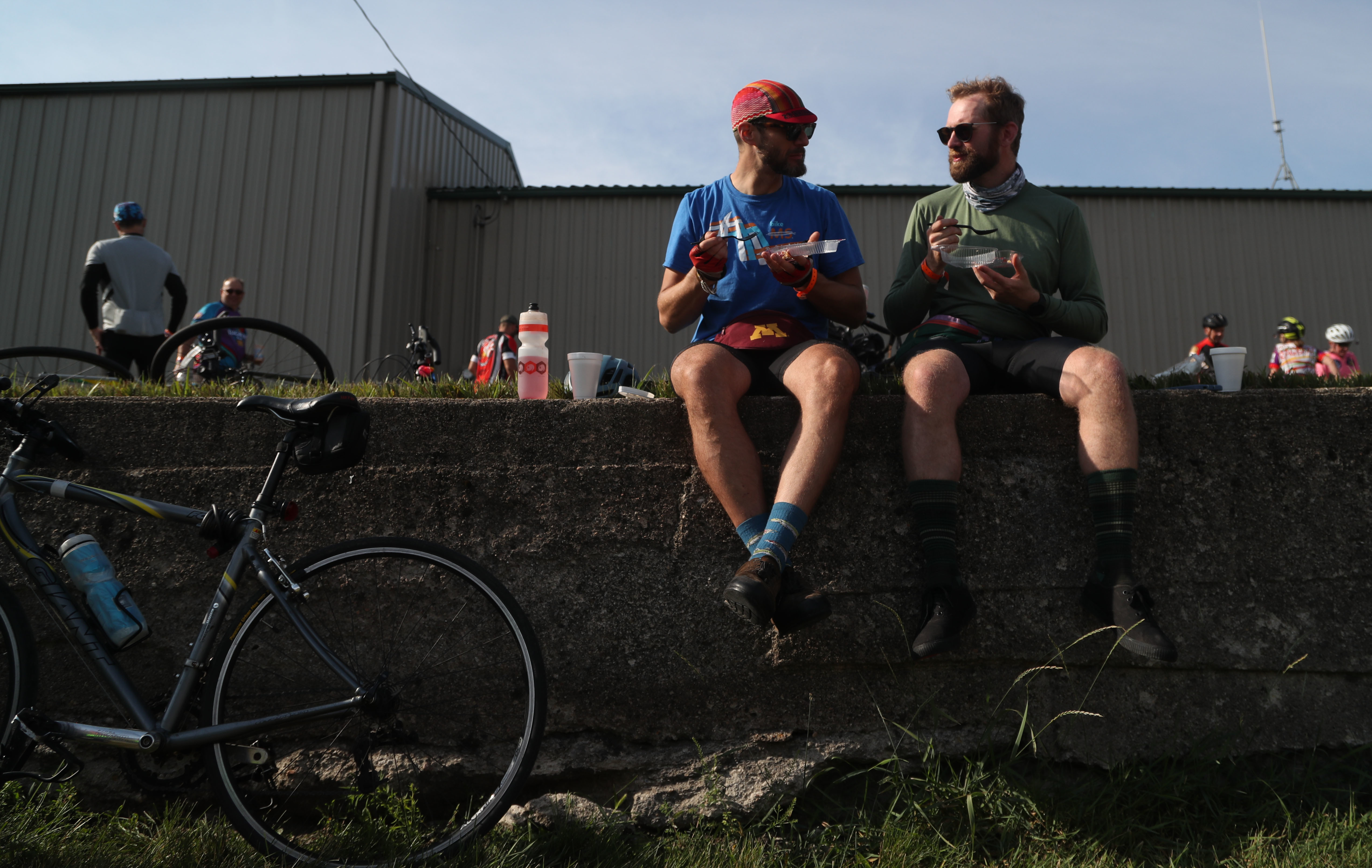 Alex Brooks of Minneapolis, Minn., (left) and Tim Connors of Robinsdale, Minn., eat slices of pie Tuesday, July 26, during a pit stop in Rolfe, Iowa. Connors said they were trying to eat a different slice of pie every day, with strawberry rhubarb, a childhood favorite, ranking as his top slice so far. "That's because the key ingredient in pie is nostalgia," Connors quipped.