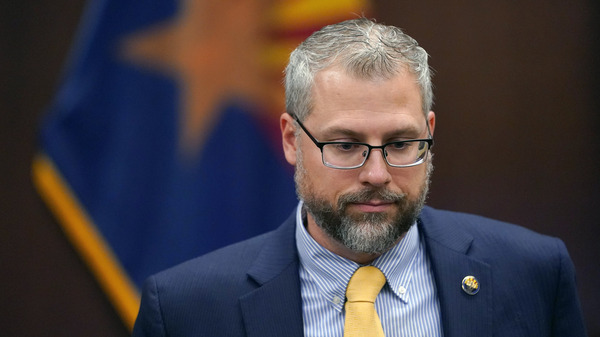 Pinal County Attorney Kent Volkmer listens to complaints while addressing Election Day ballot shortages in the county.