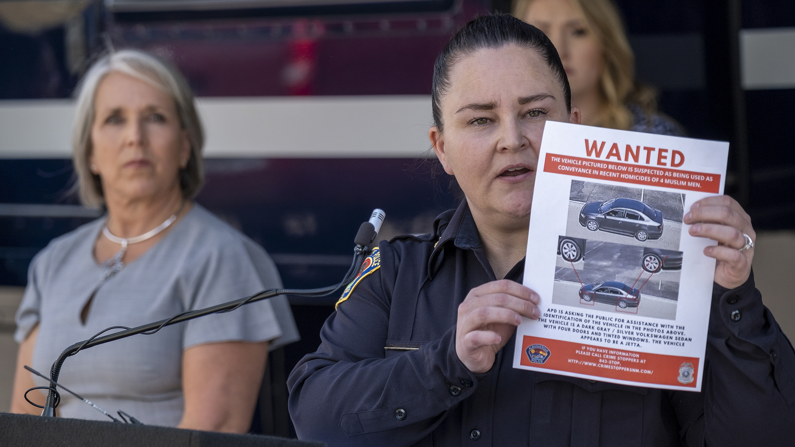 Albuquerque police detain a suspect in the killings of four Muslim men