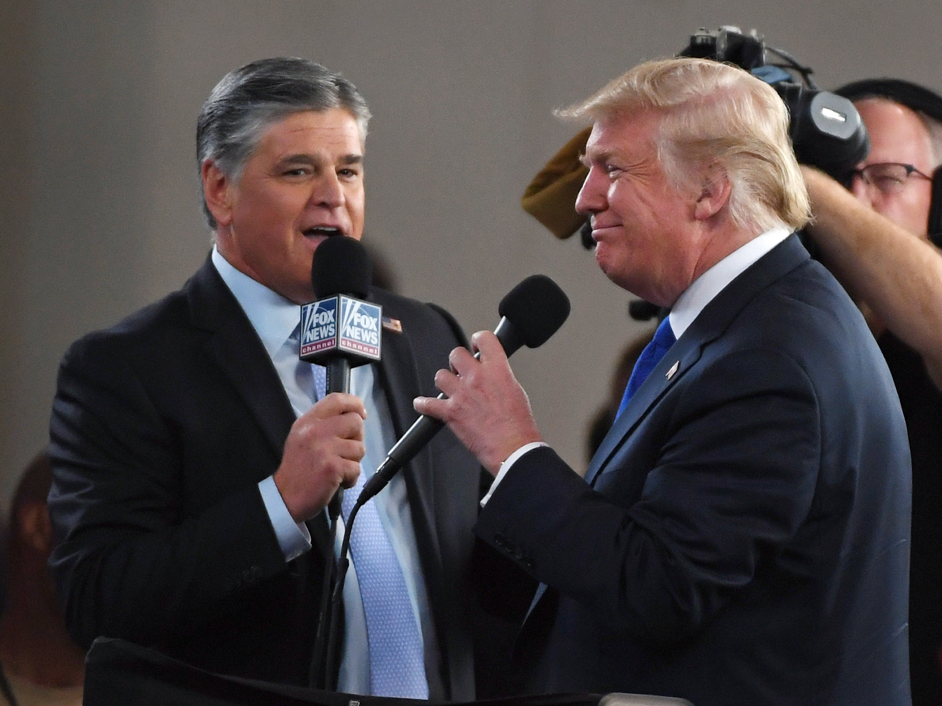 Fox News Channel and other conservative media largely leapt to former President Donald Trump's defense after the FBI searched his Mar-a-Lago resort. Here, Fox star and ally Sean Hannity (left) interviews Trump before a campaign rally in 2018 in Las Vegas. (Getty Images)