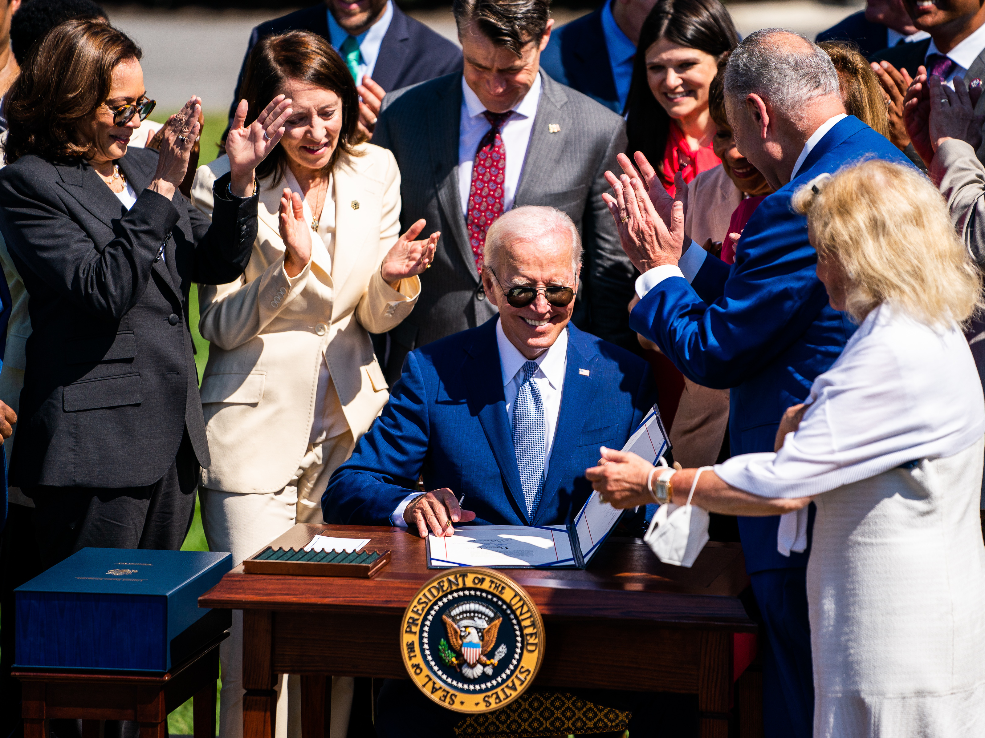 President Joe Biden signs into law the CHIPS and Science Act of 2022 on the South Lawn of the White House on Aug. 9, 2022. (The Washington Post via Getty Im)