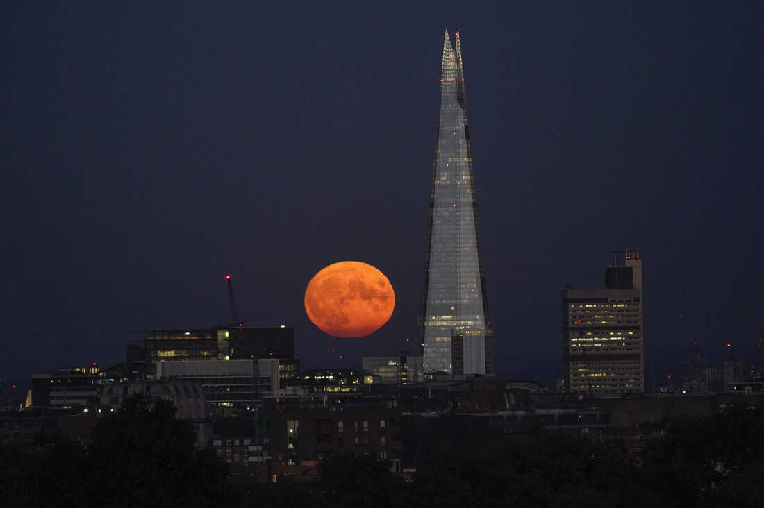 Stunning photos show the last supermoon of the year in cities across