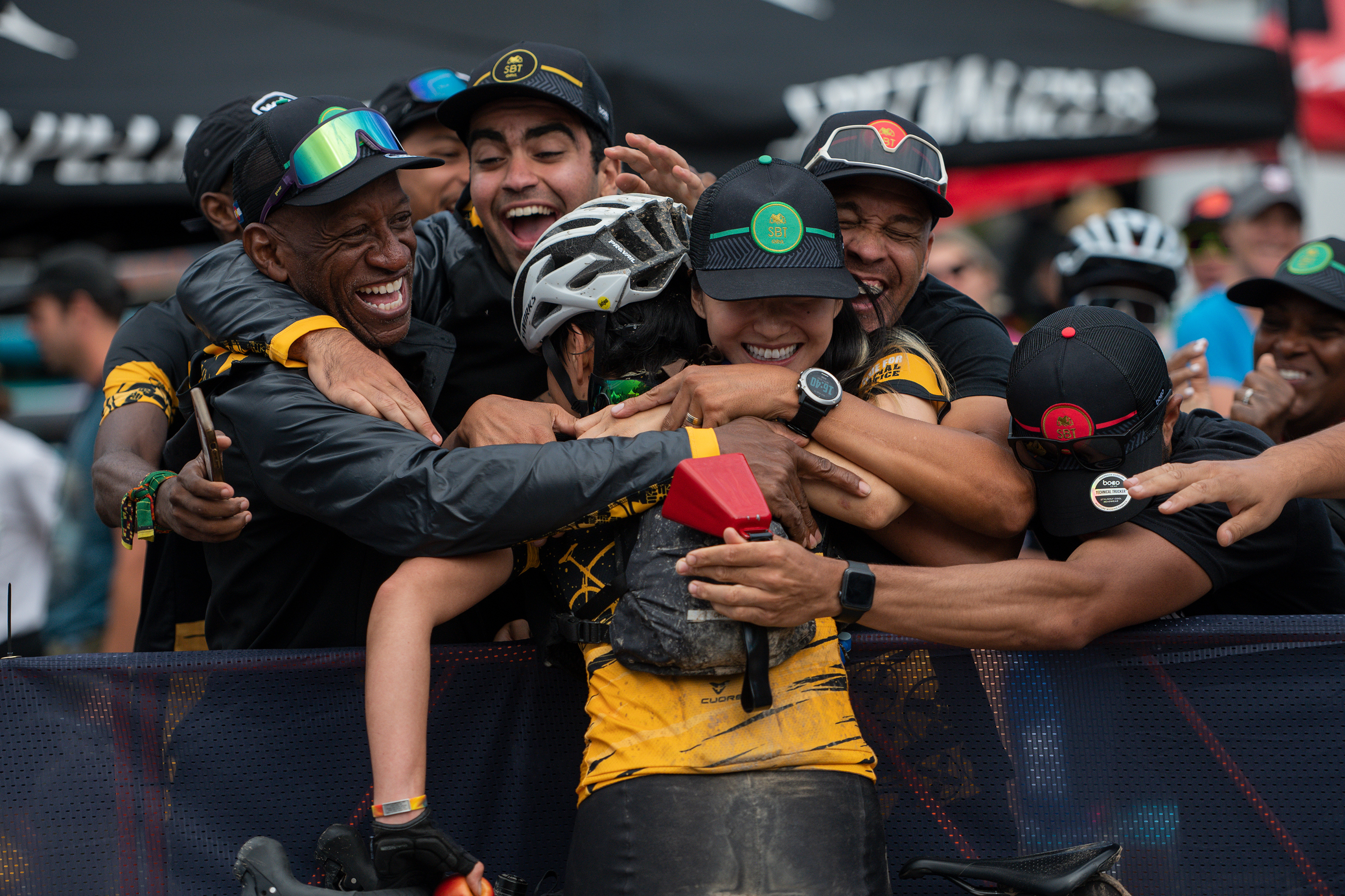 Focusing on diversity and inclusion, gravel bike racing welcomes all to this sport 14 Ride for Racial Justice co-founder Marcus Robinson, left, and other team members embrace Katy Giombolini after they finished their race during the SBT GRVL race.
