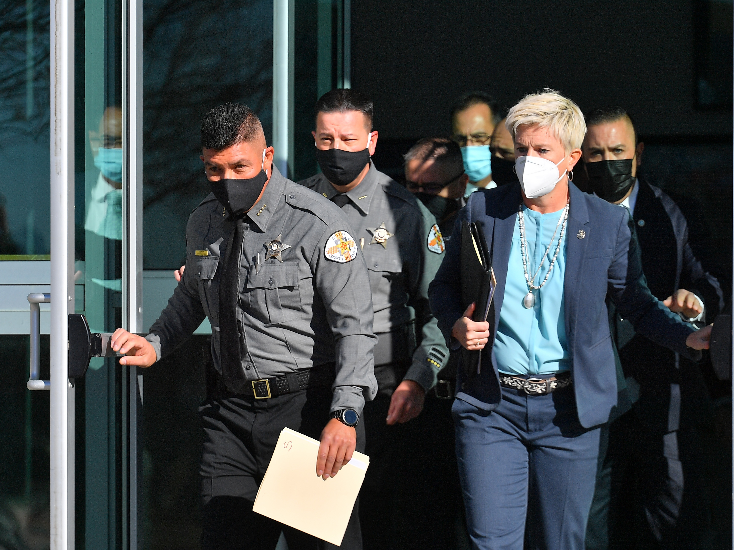 County and state officials exit the Santa Fe County Public Safety Building in New Mexico ahead of a news conference to update members of the media on the shooting accident on the set of the movie <em>Rust</em>. (Getty Images)