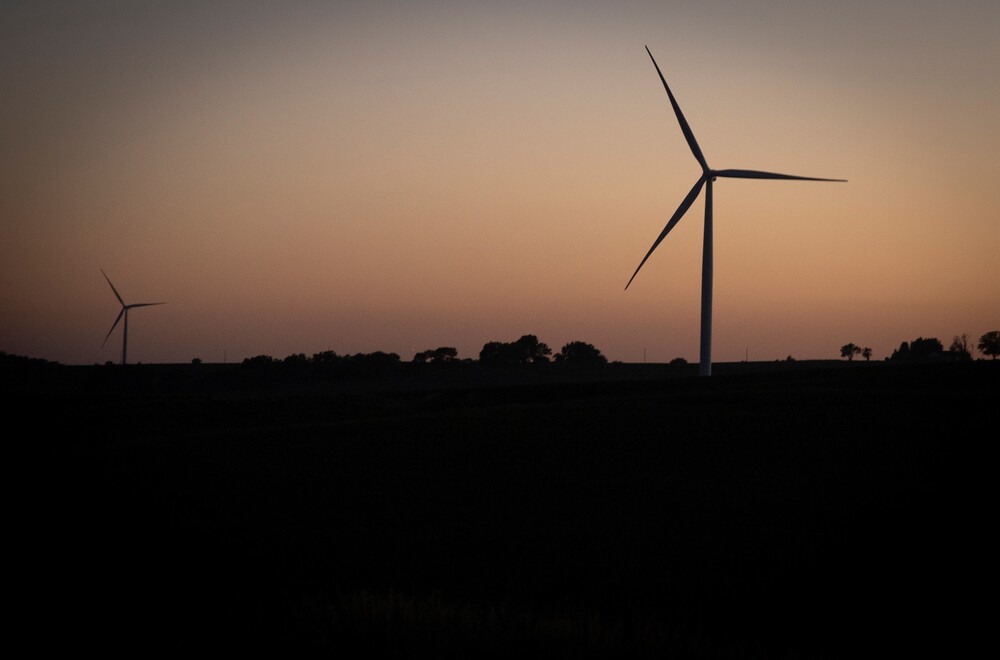 Wind turbines have become a common site throughout rural Iowa like this wind farm along Interstate 80 in Adair County, Iowa. (Clay Masters)