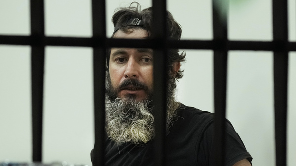 Bassam al-Sheikh Hussein looks through the bank