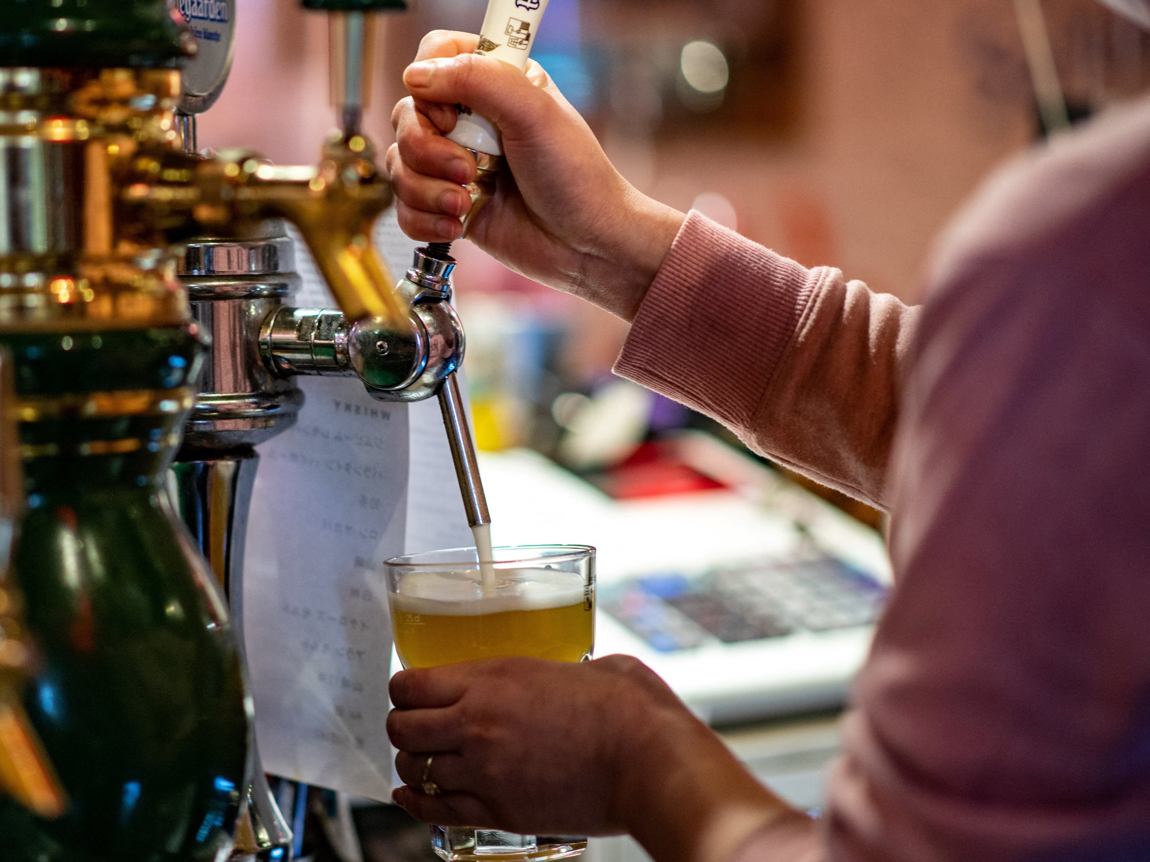 The COVID-19 pandemic has hit Japan's alcohol industry hard, sharpening a long-running trend away from drinking. A new campaign sponsored by the National Tax Agency hopes to change that — but it's running into sharp criticism. (AFP via Getty Images)