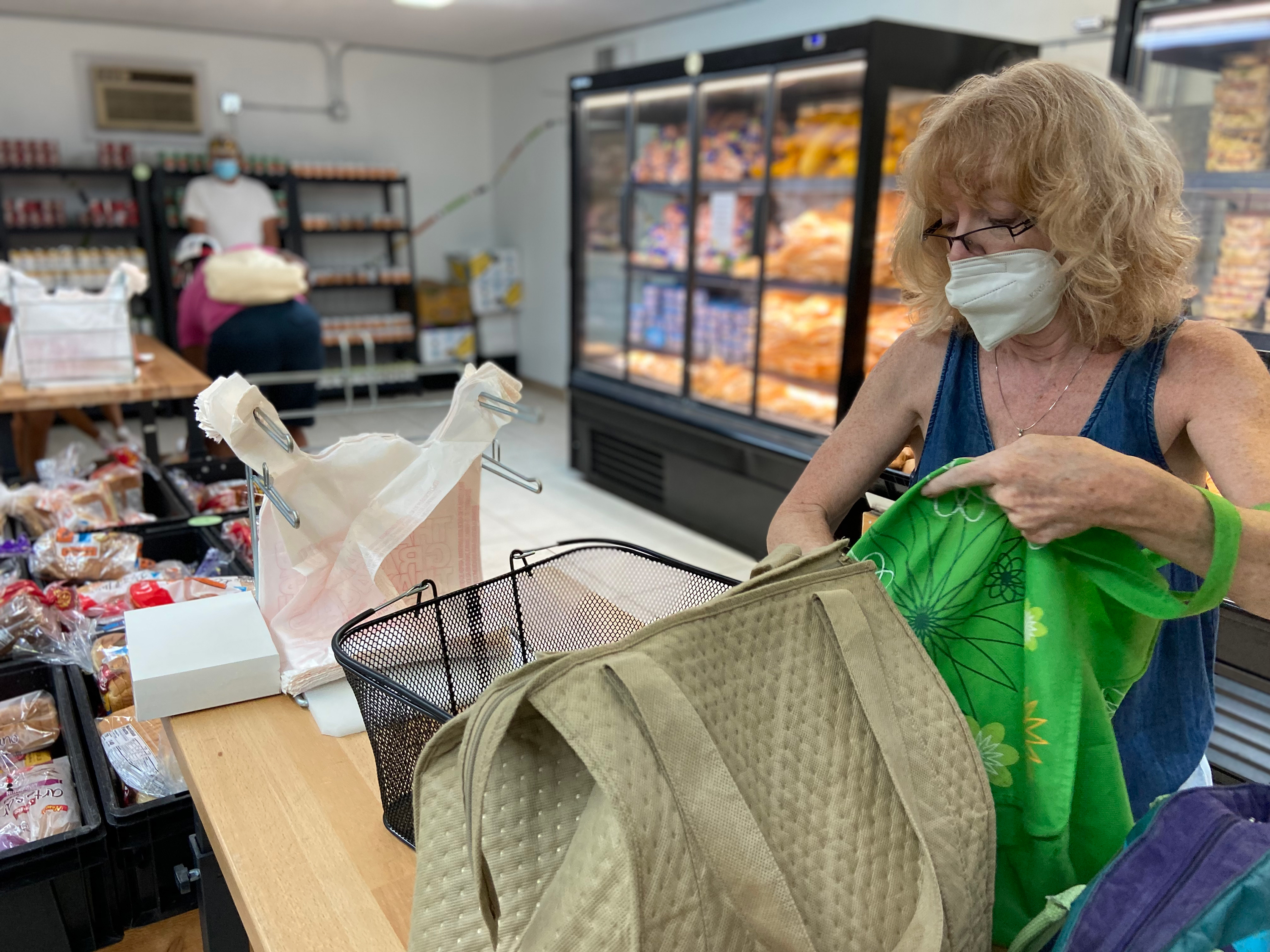 Jill Mallen gets her groceries at a food pantry because of soaring inflation. She says she's a &quot;confused&quot; voter — a registered Democrat who feels Republicans did a better job of managing the economy. (NPR)