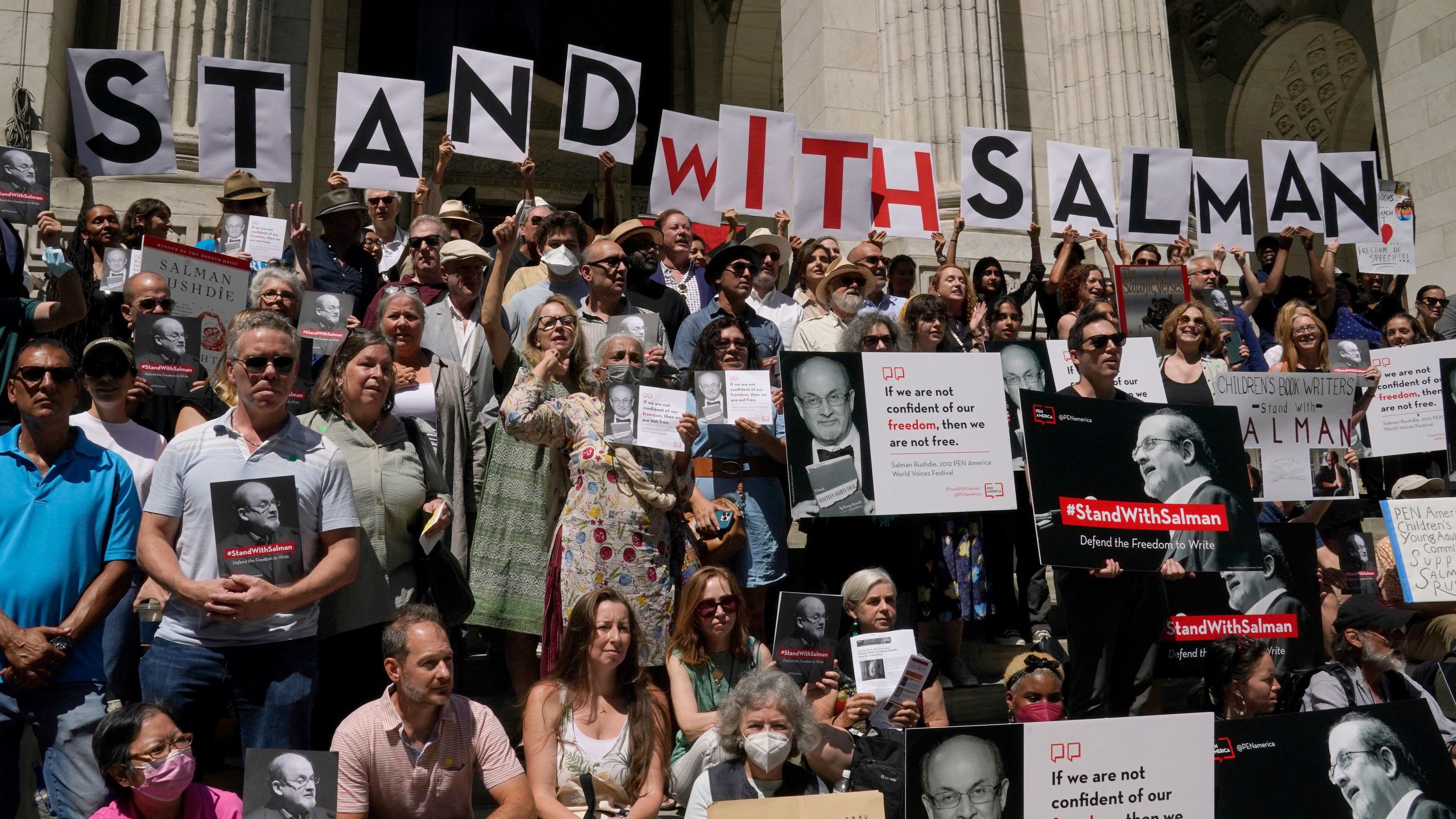 At a rally outside the New York Public Library, writers including Paul Auster and Gay Talese read passages from Salman Rushdie