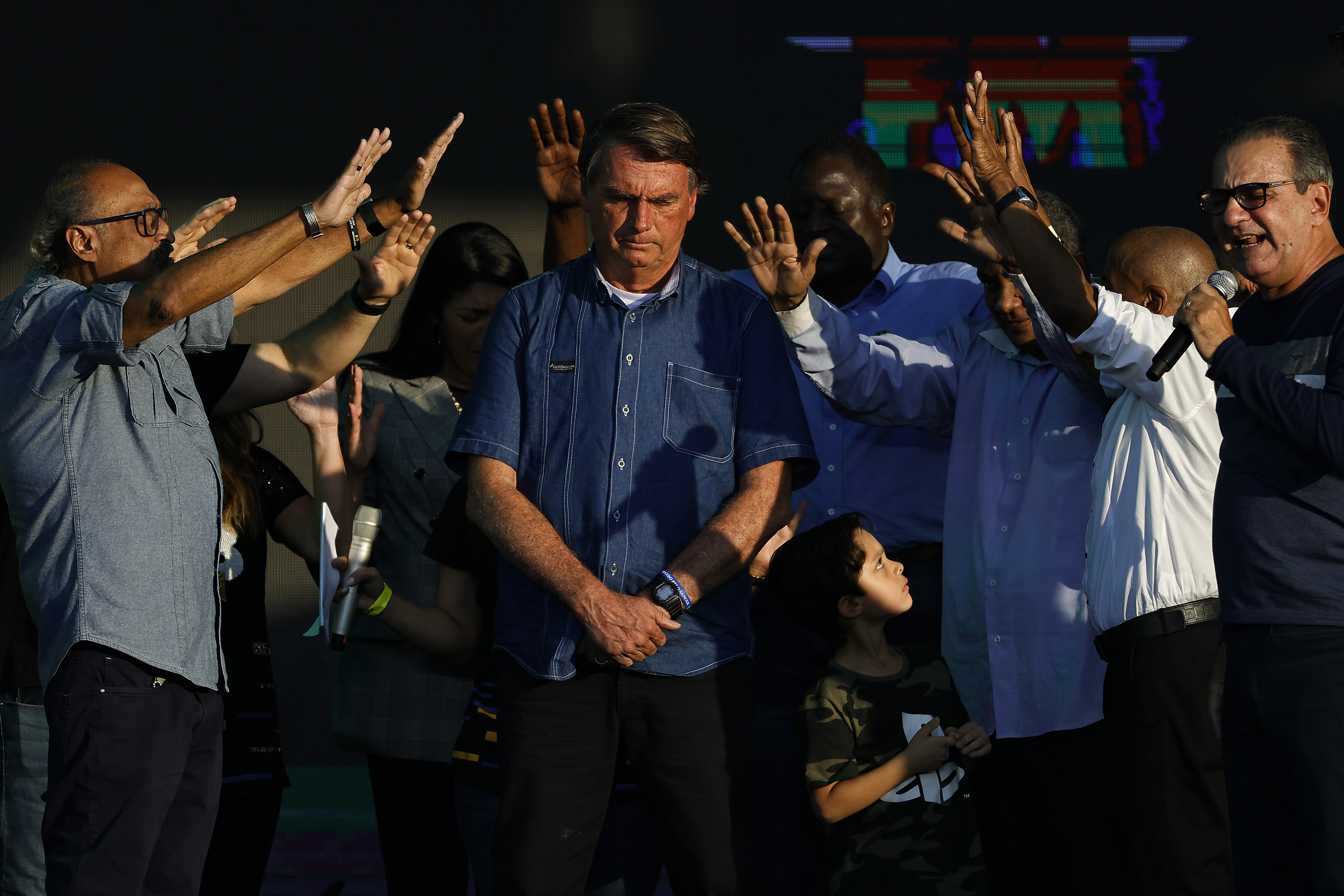Brazilian President Jair Bolsonaro receives a blessing during a music festival organized by a local evangelic radio station on July 2, in Rio de Janeiro. (Getty Images)