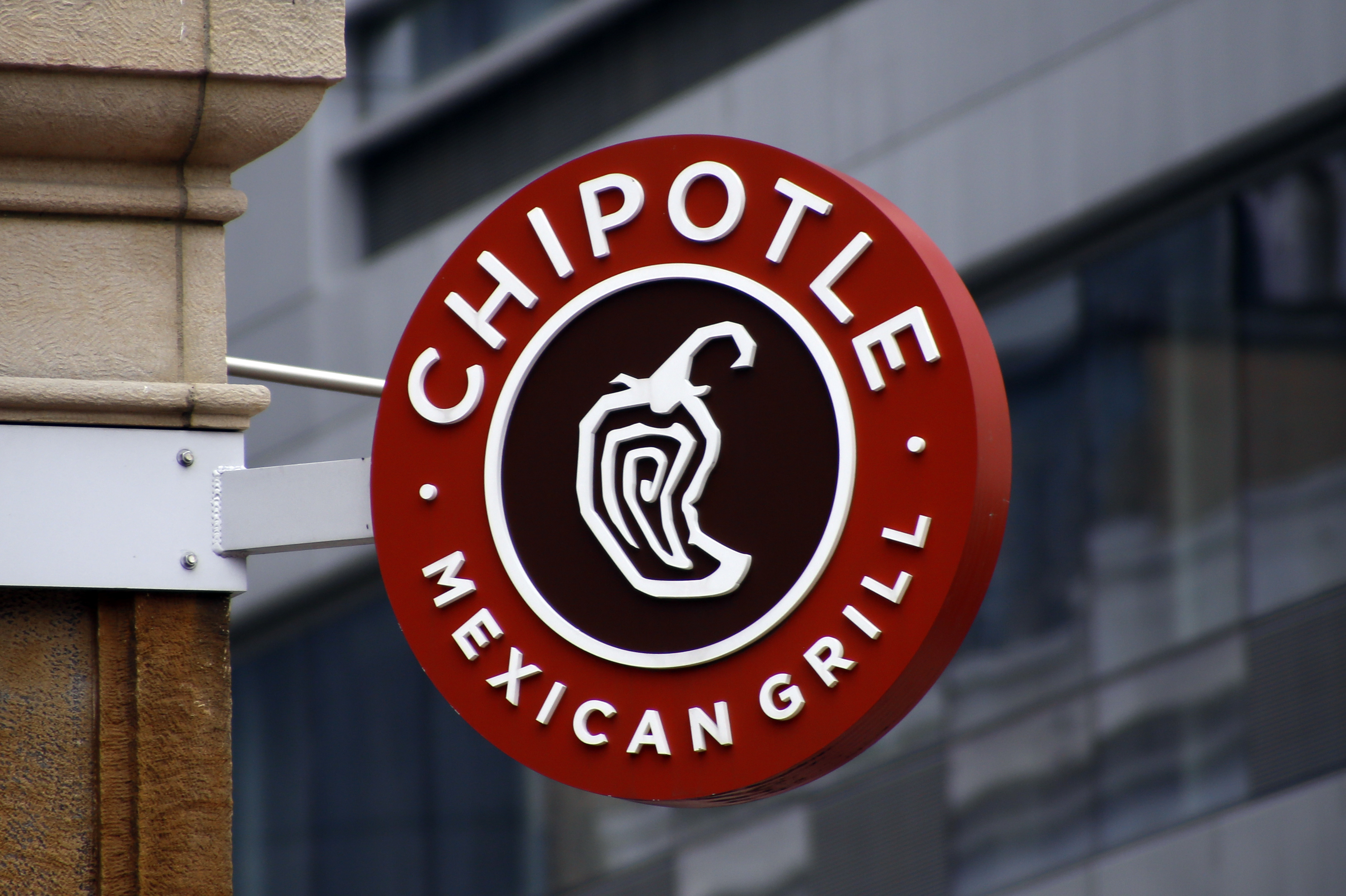 A Chipotle sign hangs outside the chain restaurant in Pittsburgh on Feb. 8, 2016. In June 2022, employees of the Augusta, Maine, Chipotle filed a petition with the National Labor Relations Board asking to hold a union election at the store. The NLRB had scheduled a hearing July 19, 2022. But Chipotle announced the same day it was permanently closing the store.