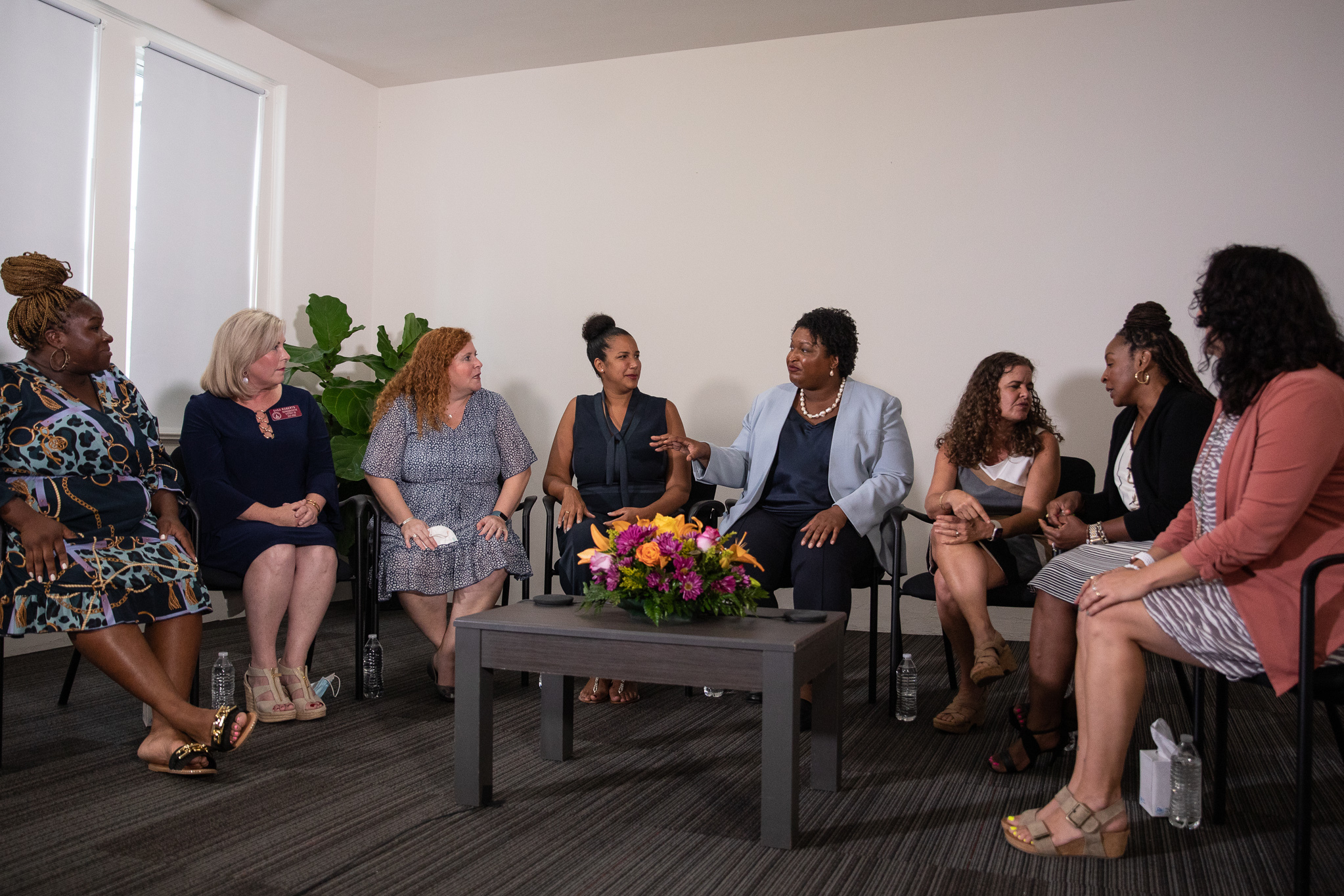 Georgia Democratic gubernatorial candidate Stacey Abrams joins a group of women as they discuss their personal stories of miscarraige at her campaign headquarters in Decatur, Ga. on Aug. 3. (Riley Bunch/GPB)