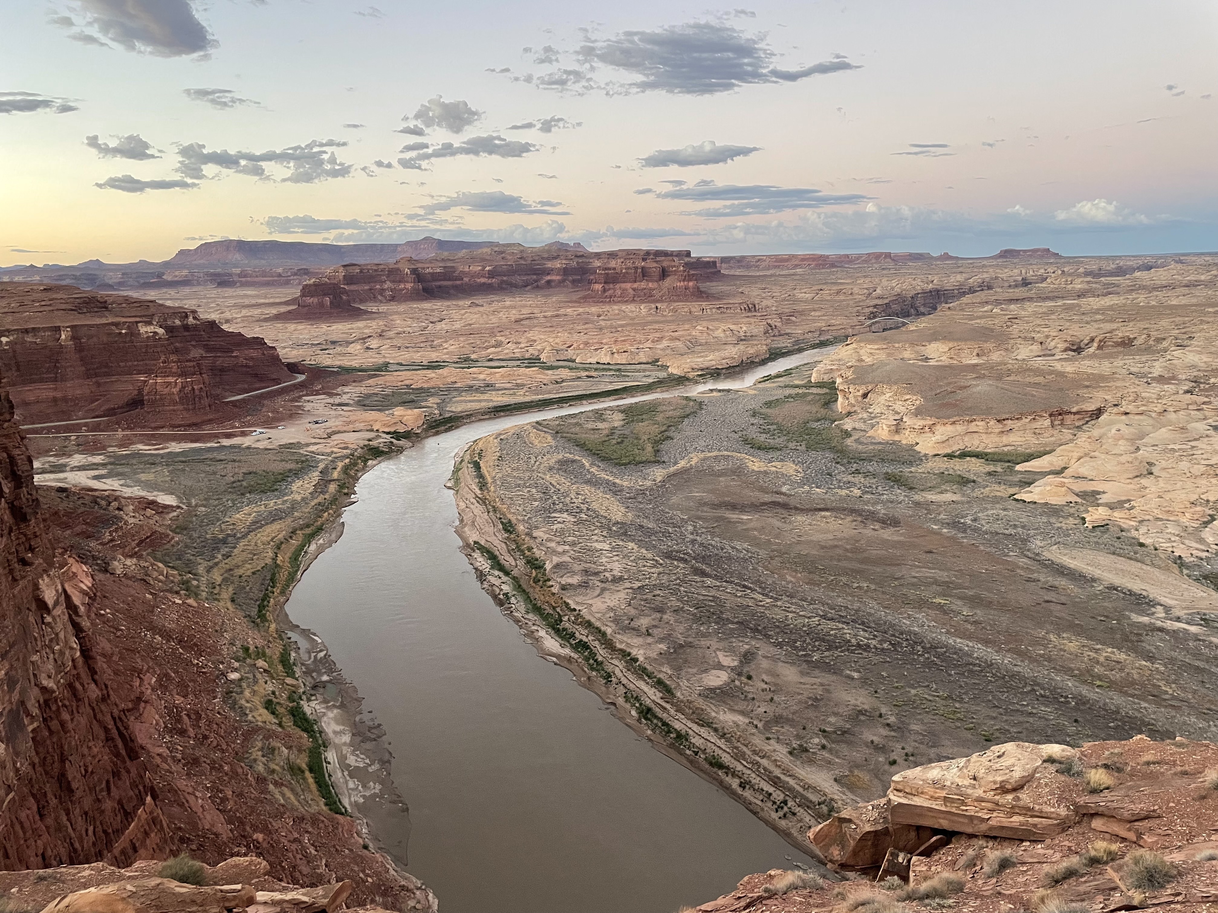 The Colorado River flows over mud flats upstream of Lake Powell near Hite, Utah. (Luke Runyon/KUNC)