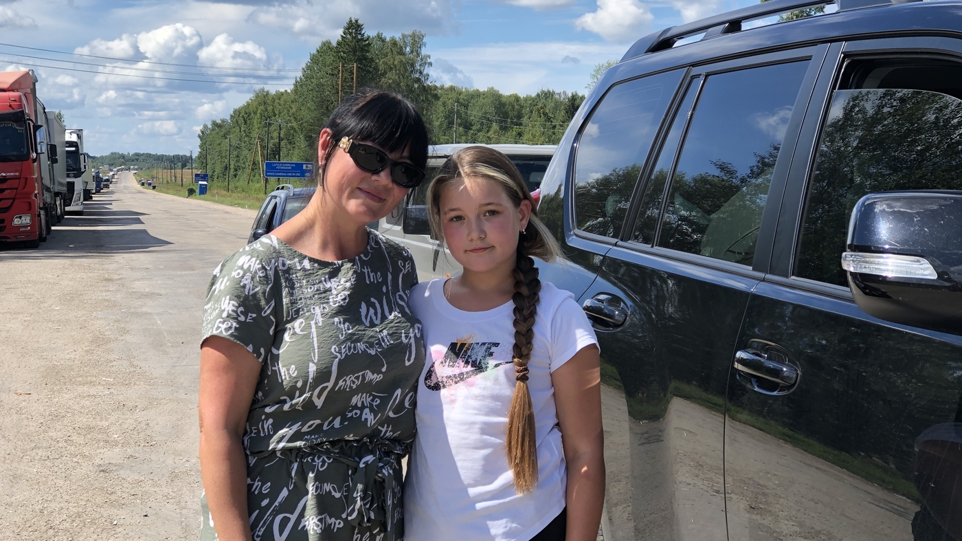 At Latvia's border with Russia, the line grows long, and tempers short