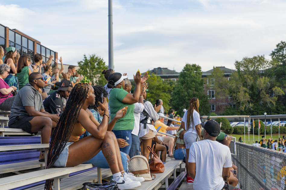 Belhaven fans cheer in the stands at the Belhaven University vs. Millsaps College football game in Jackson, Mississippi.