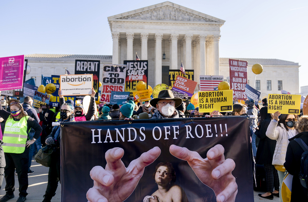 Abortion rights advocates and anti-abortion protesters demonstrate in front of the U.S. Supreme Court on Dec. 1, 2021. Heading in the 2022 midterm elections, abortion leads as the top issue for Democrats. For Republicans, it is inflation. For independents, inflation also tops and abortion ranks second.