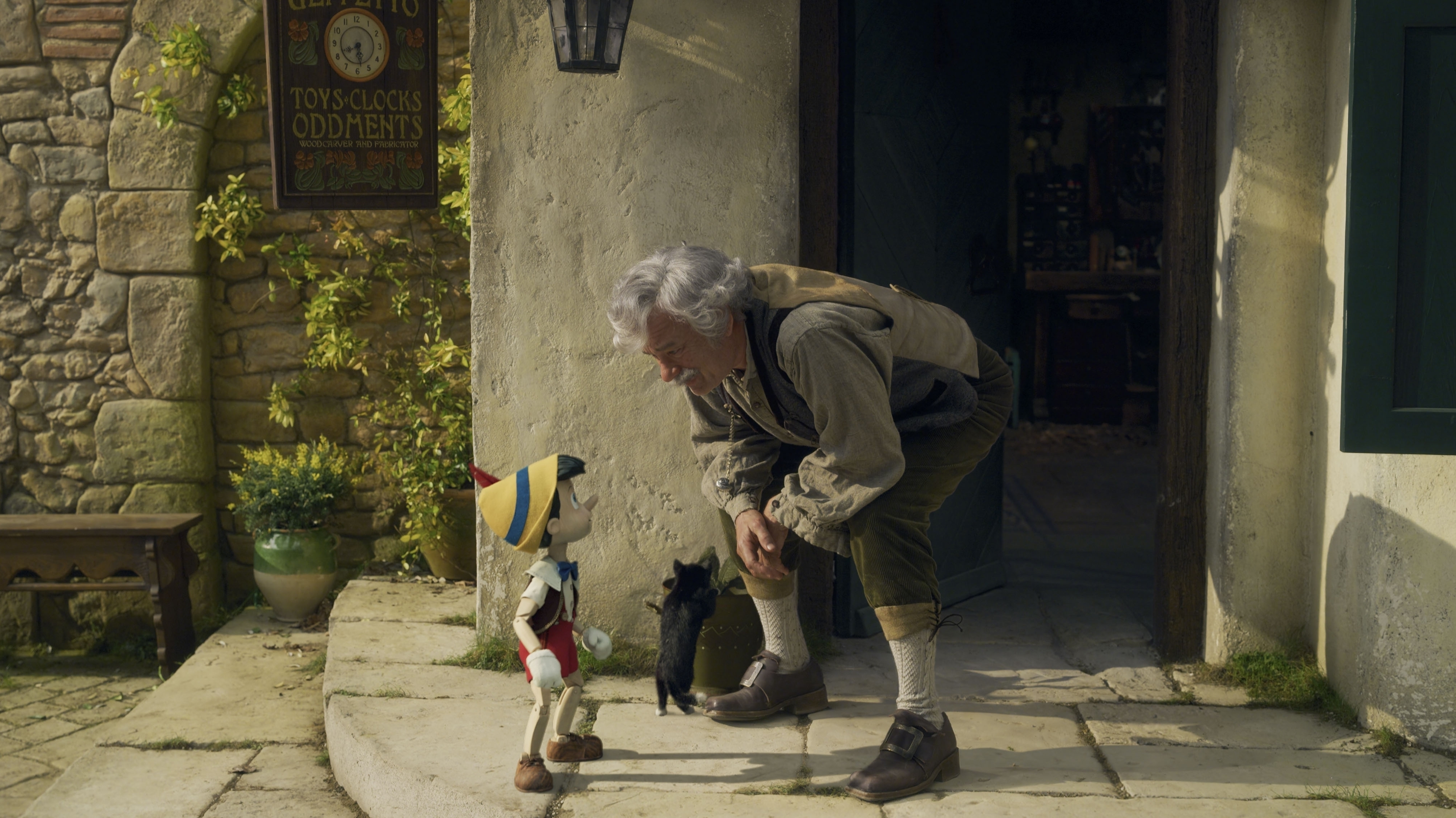 Pinocchio (Benjamin Ainsworth) and Geppetto (Tom Hanks) in a remake of the 1940 animated film. (Disney +)