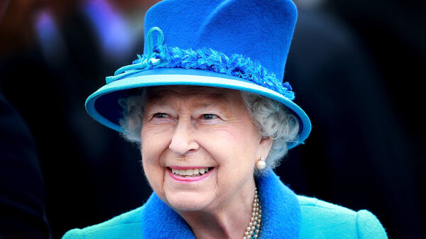 Queen Elizabeth wears a blue hat