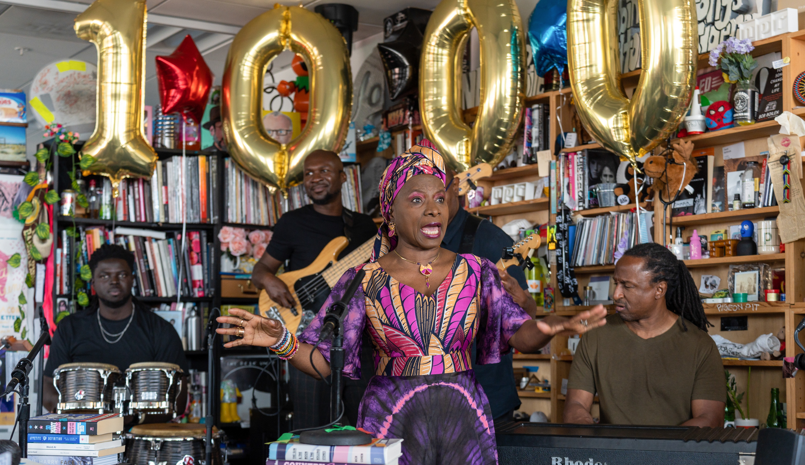 Angélique Kidjo performs at the 1,000th NPR's Tiny Desk Concert. She sings the praises of the series: &quot;The Tiny Desk Concerts bring the whole world into this tiny place where you can make miracles and wonder.&quot; (Bob Boilen/NPR)