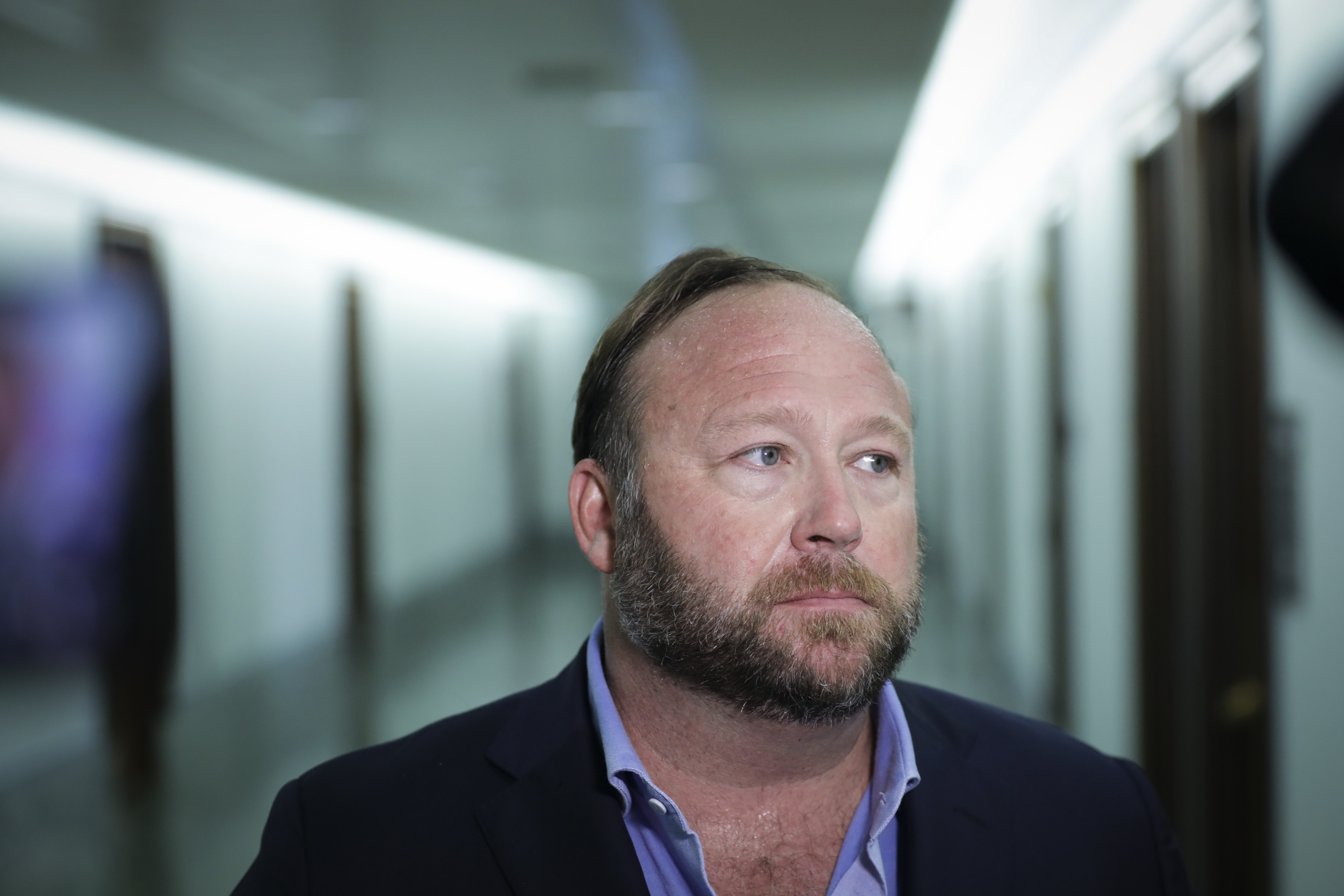 Conspiracy theorist Alex Jones, seen here in 2018, and his network of websites have been banned from most major online and social media platforms but have still managed to bring in tens of millions of dollars in revenue. (Getty Images)