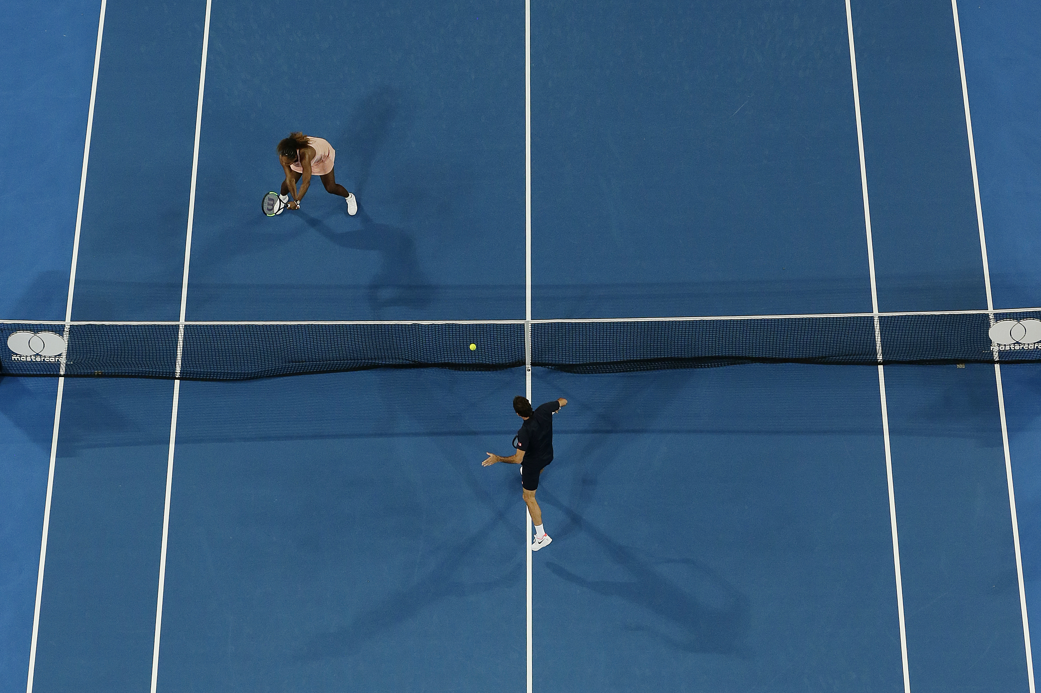 January 1, 2019: Roger Federer of Switzerland plays a shot to Serena Williams of the United States in the mixed doubles match during day four of the 2019 Hopman Cup at Perth Arena in Perth, Australia.
