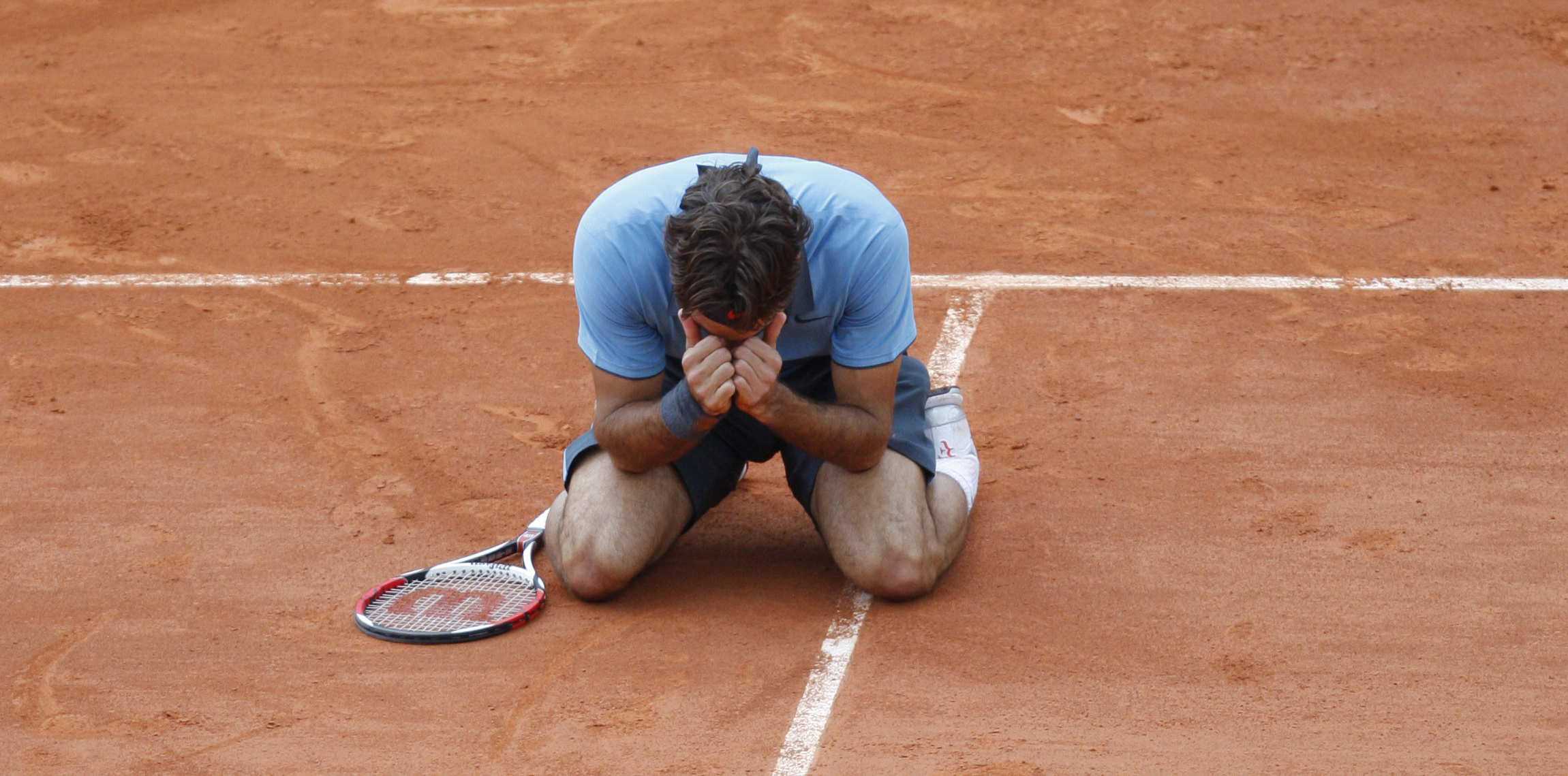 June 7, 2009: Switzerland's Roger Federer jubilates after defeating Sweden's Robin Soderling during their men's singles final match of the French Open tennis tournament at the Roland Garros stadium in Paris.