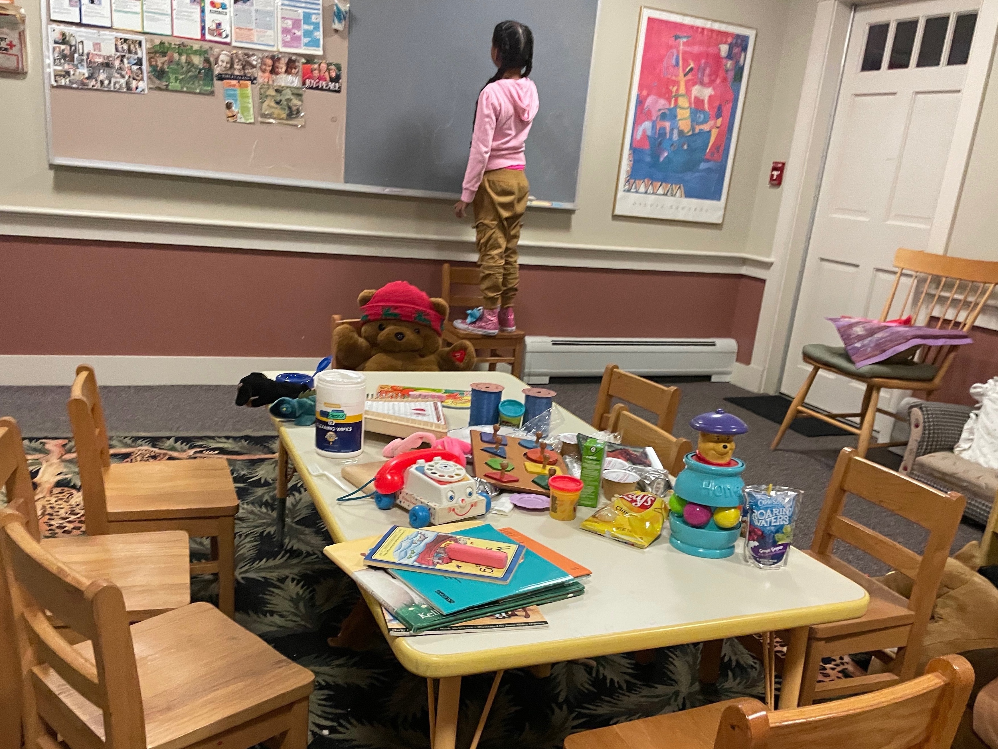 A young girl is shown staying at a shelter on Martha's Vineyard, Mass., after she and dozens of other migrants arrived by plane unannounced Wednesday. (WCAI)