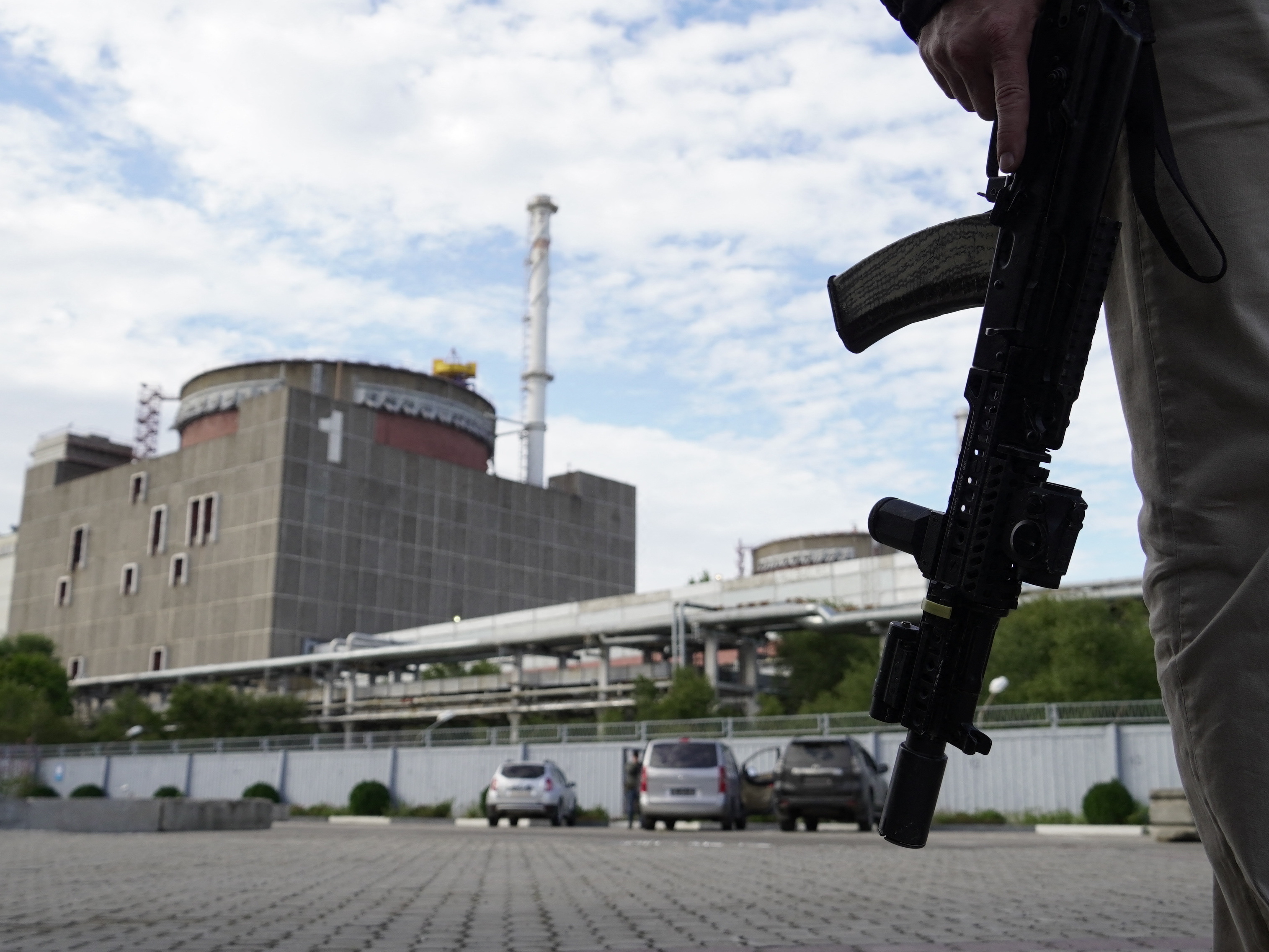 A security person stands in front of the Zaporizhzhia nuclear power plant on September 11. (AFP via Getty Images)