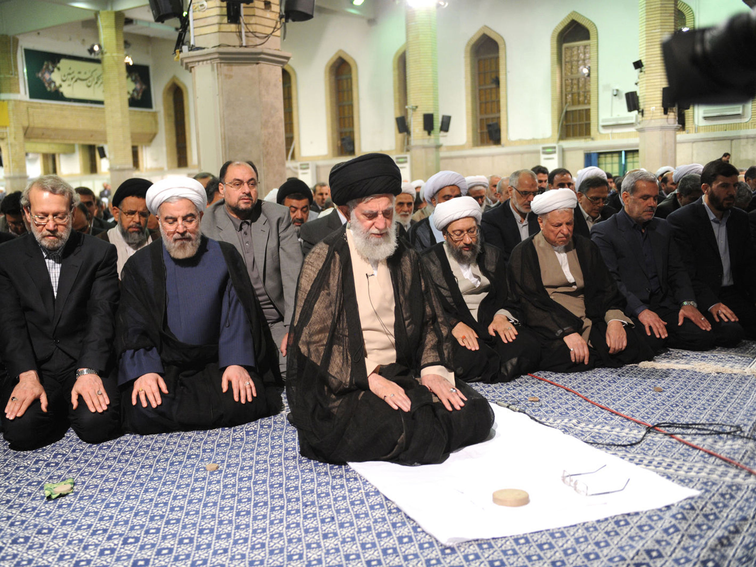Iranian supreme leader killed in Israeli airstrike 3 Iran's supreme leader, Ayatollah Ali Khamenei (center), prays with the Iranian president and other government officials in Tehran in 2014.