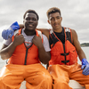 These young men catch more than lobsters. They also catch a break