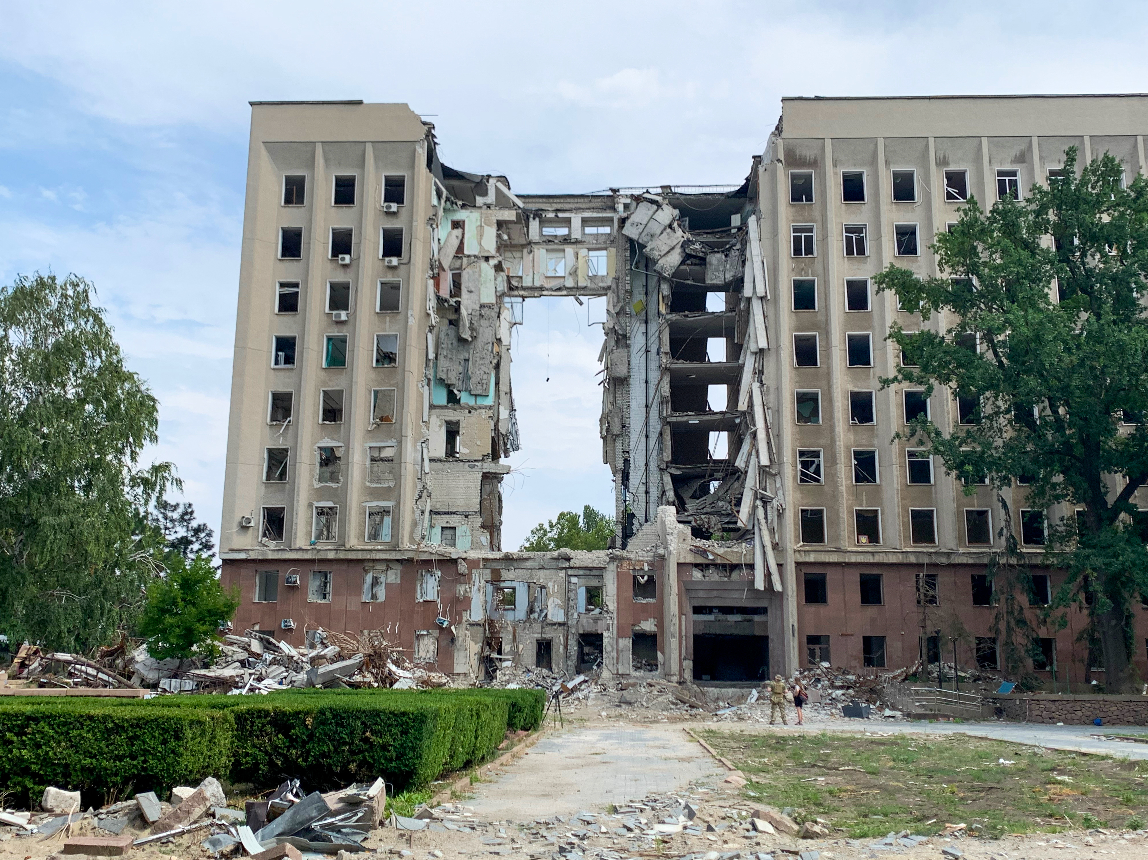 The building housing Mykolaiv's regional government, bombed early in the war, lies in ruins on Aug. 11. Governor Vitaliy Kim says he knew he was the target &quot;because it was my window.&quot; Thirty-seven of his colleagues died in the bombing. (NPR)