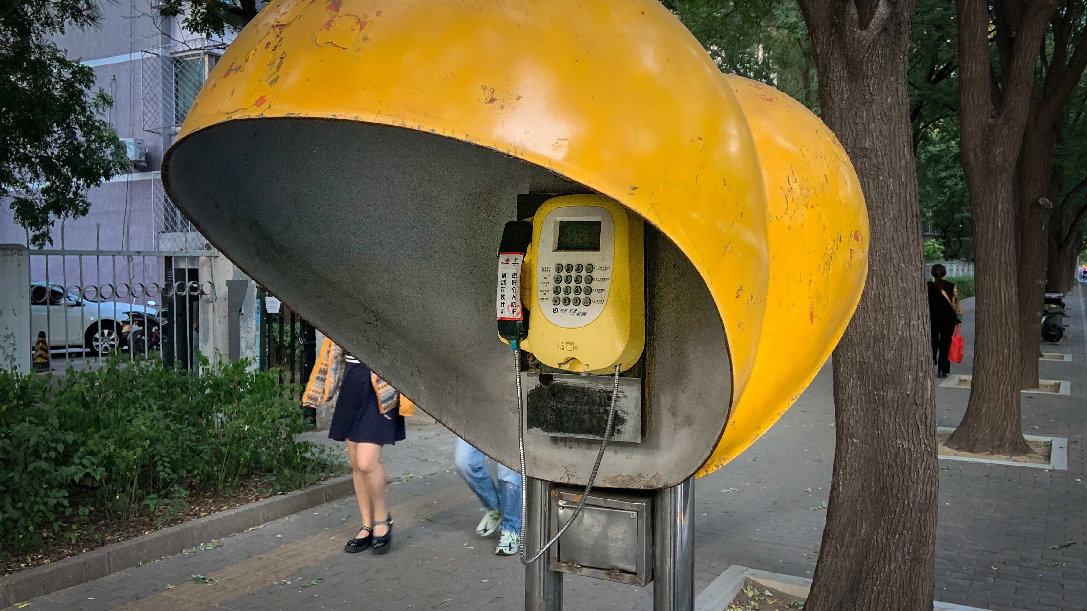 In July, this Beijing payphone began ringing. Who was calling?