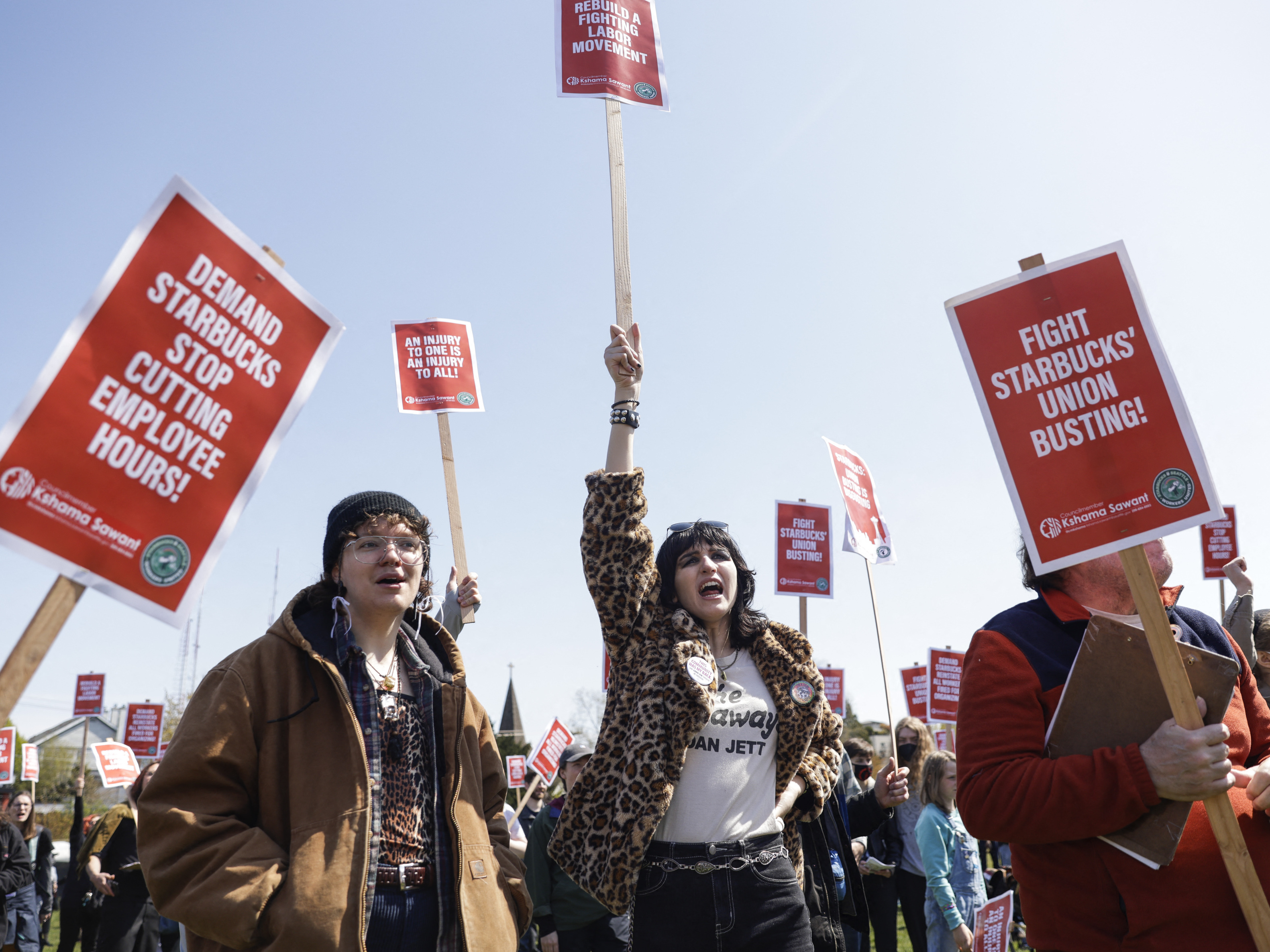 Marchers raise picket signs during a &quot;Fight Starbucks' Union Busting&quot; rally held in Seattle in April. (AFP via Getty Images)
