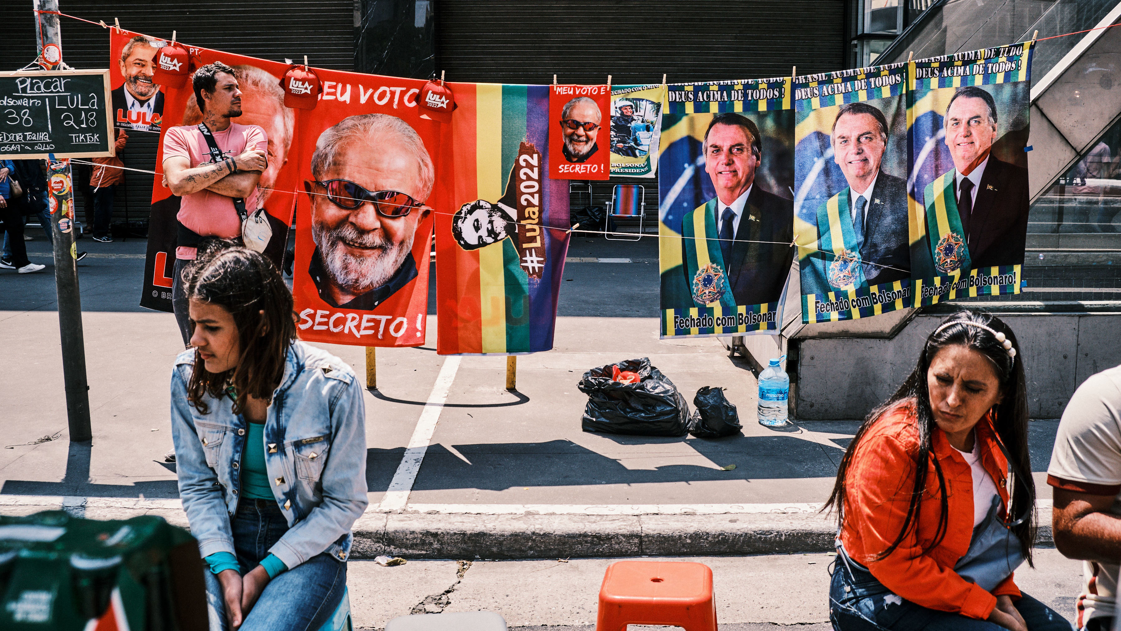 A street stall sells towels of presidential candidates Luiz Inácio Lula da Silva and Jair Bolsonaro on Sept. 25 in São Paulo, Brazil.