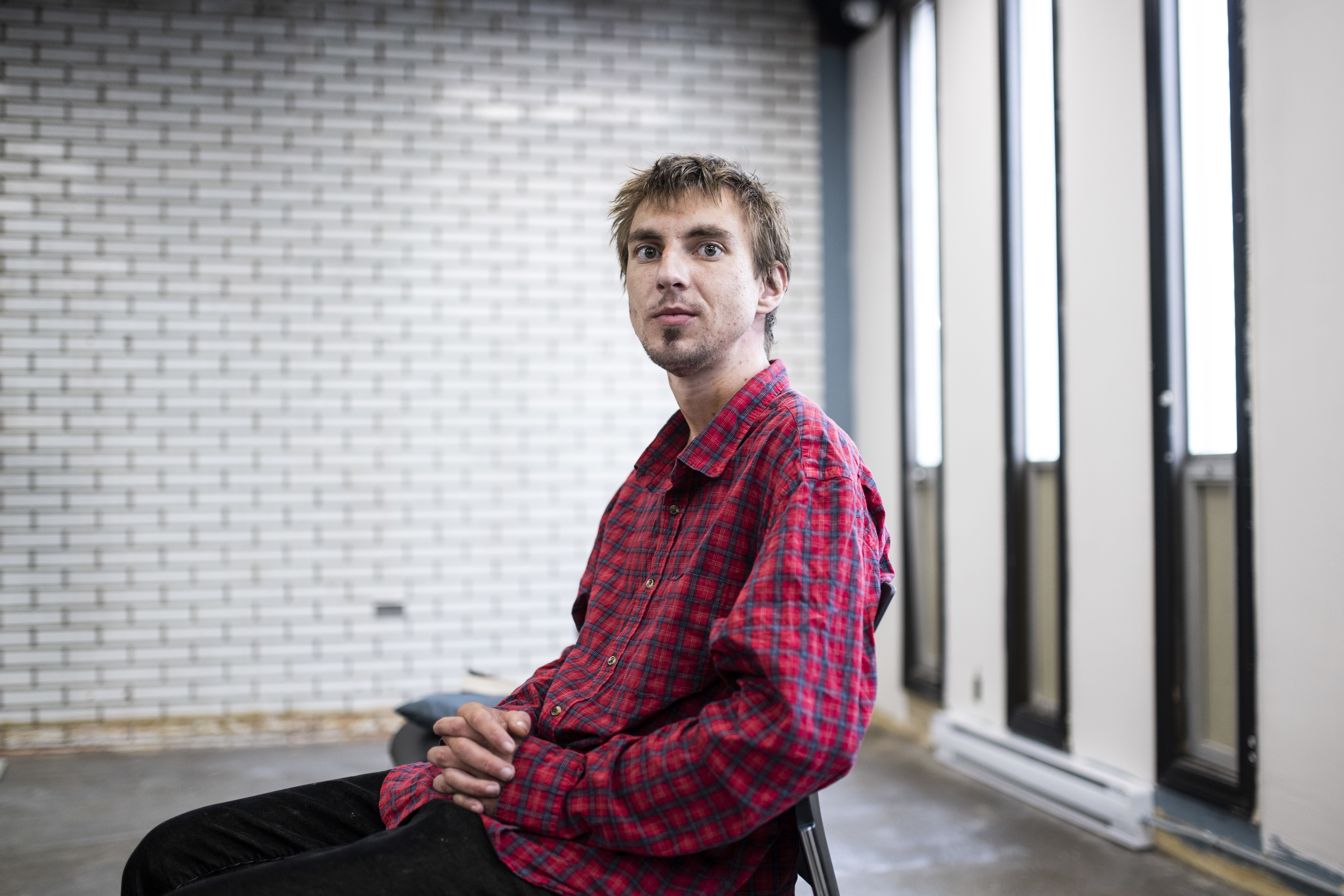 Max, last name withheld, is shown at a Recovery Care clinic where he is a client, in Ottawa, Ontario, on Wednesday, June 29, 2022. (Justin Tang for NPR)