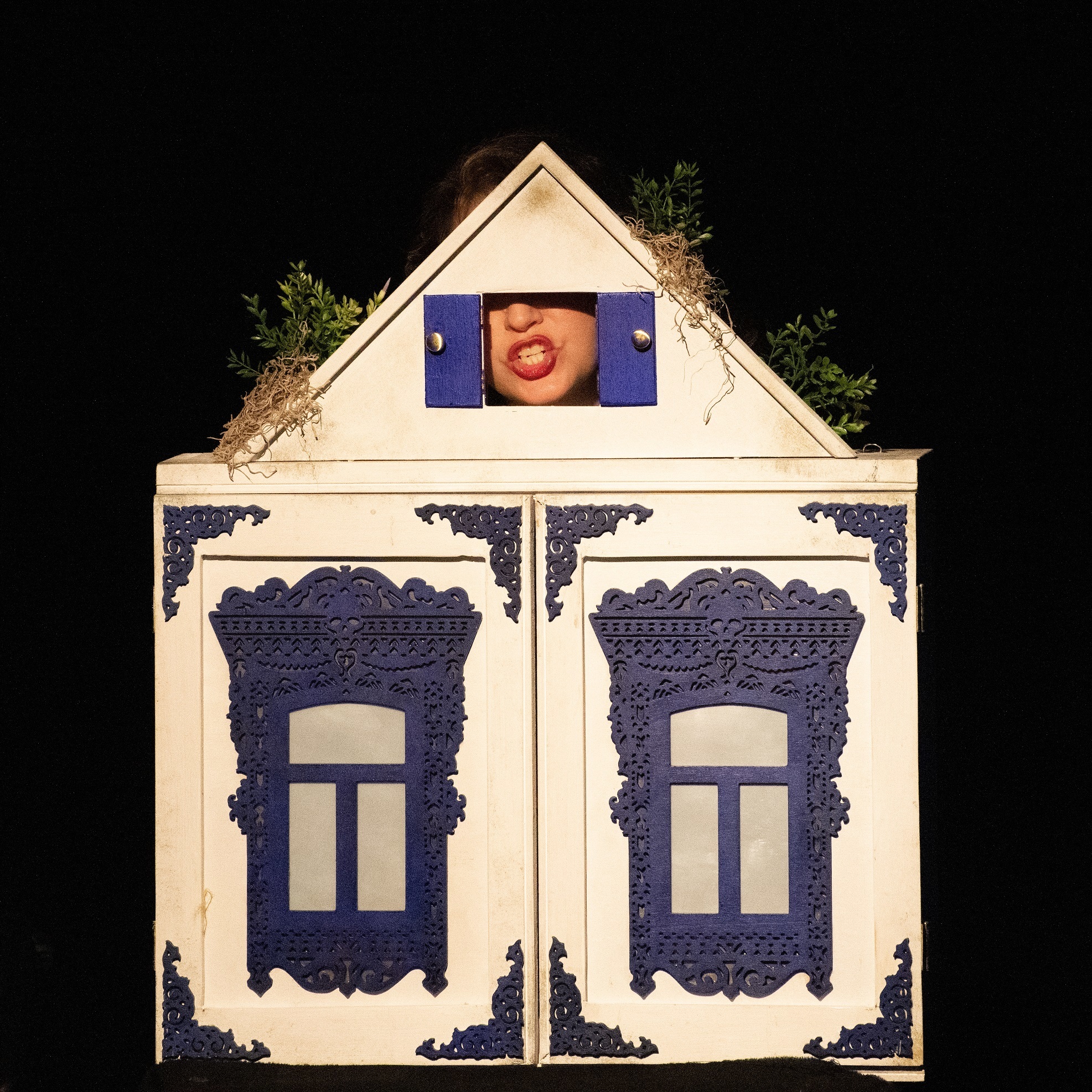 Retired cabinetmaker Gilbert Ruff built the theater box that GennaRose Nethercott uses in her own traveling puppet show, pictured here on the day of her book launch.