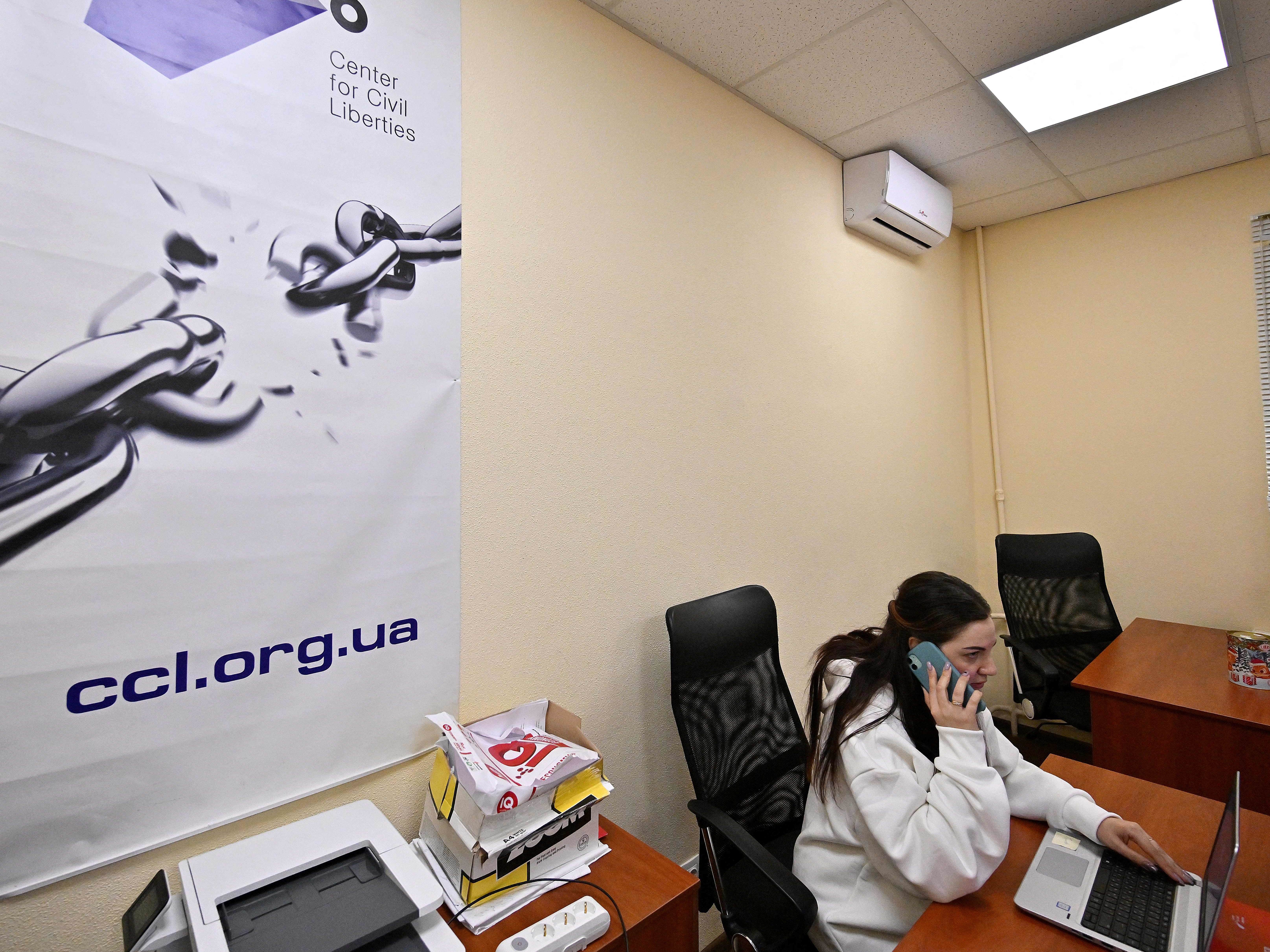 An employee of Ukraine's Center for Civil Liberties works in the office in Kyiv on Friday. (AFP via Getty Images)