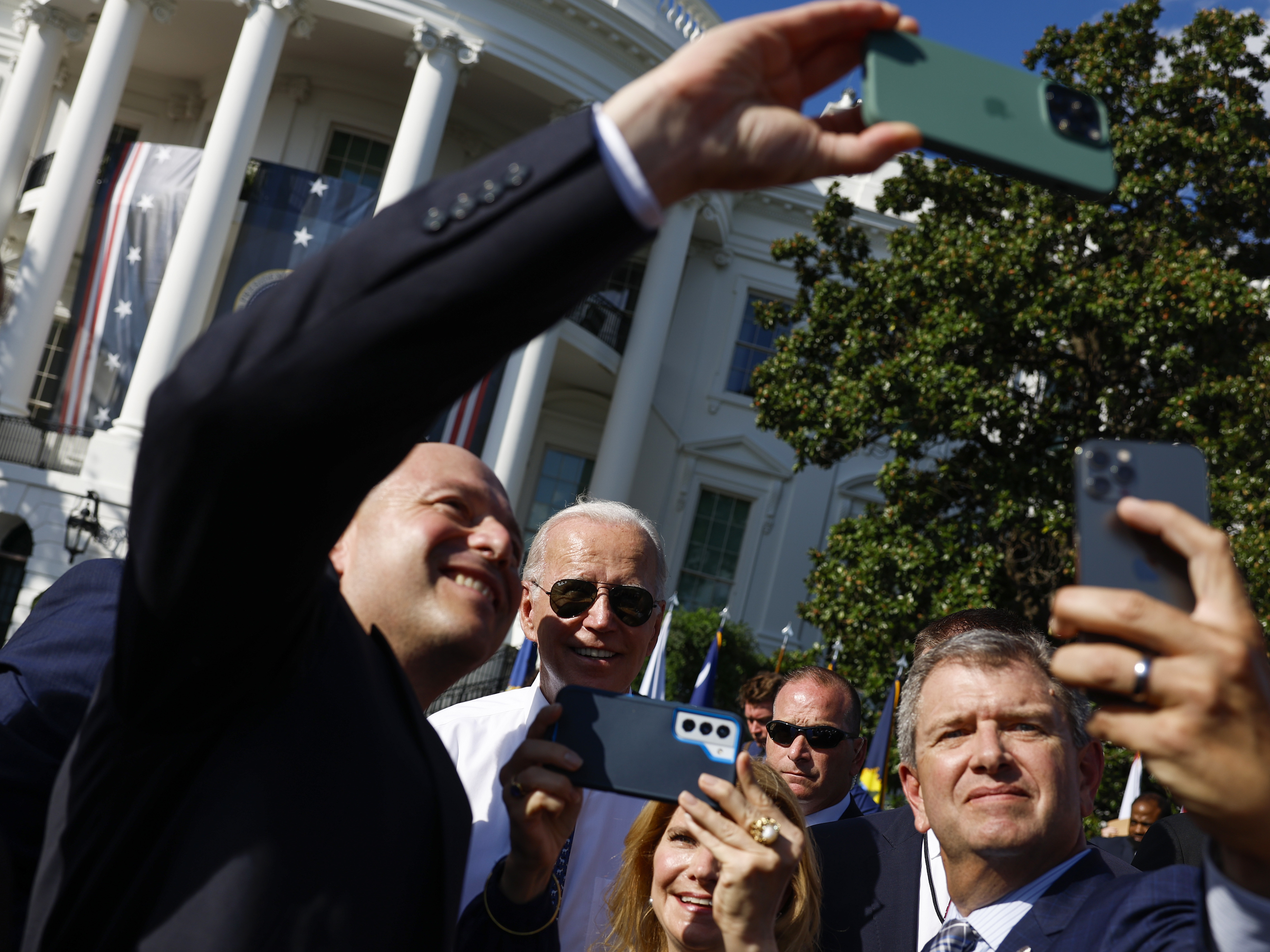 President Biden takes pictures with guests after speaking at an event celebrating the passage of the Inflation Reduction Act on the South Lawn of the White House on Sept. 13. (Getty Images)