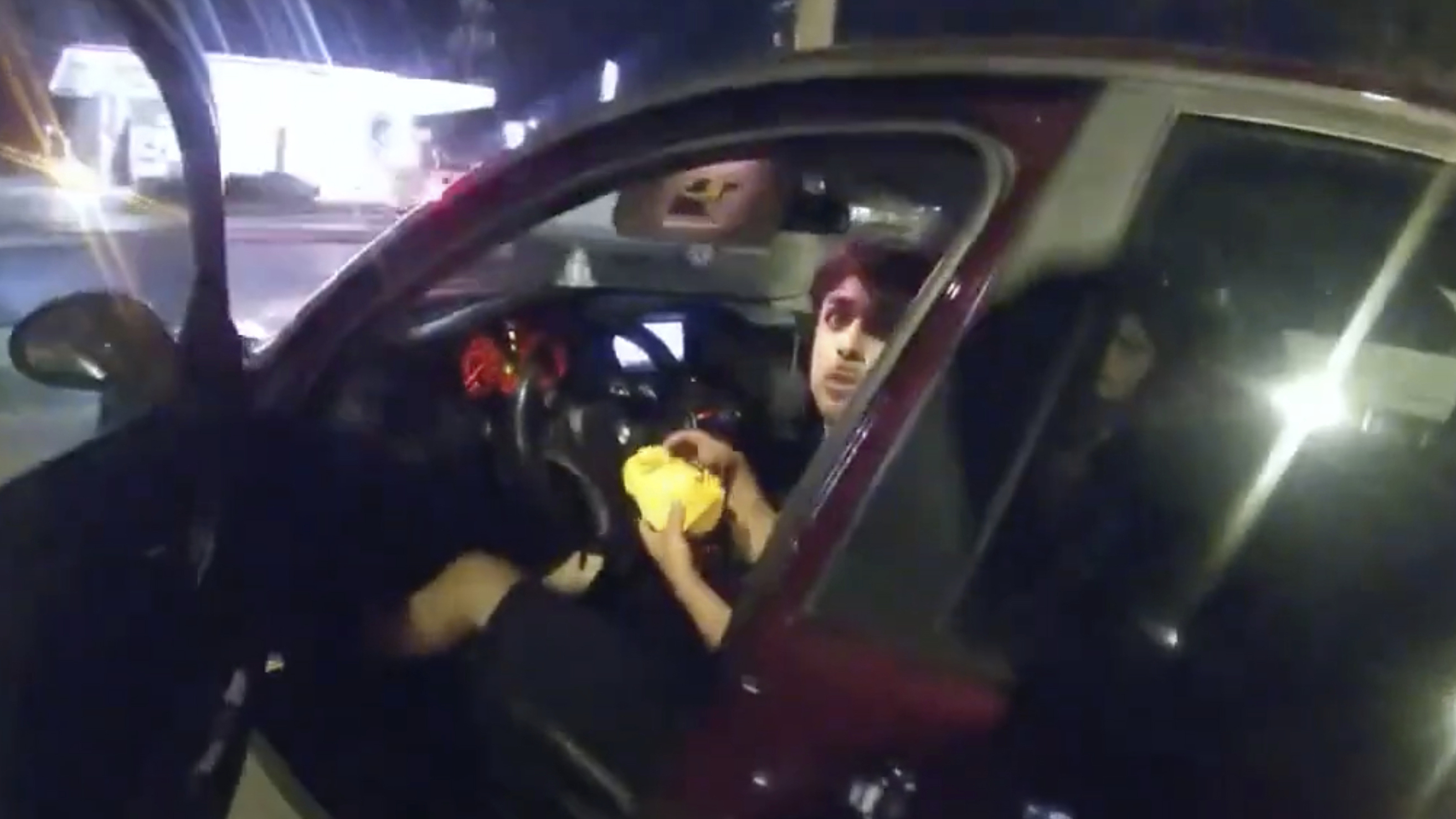 An ex-police officer is charged after shooting a teenager eating in a parking lot